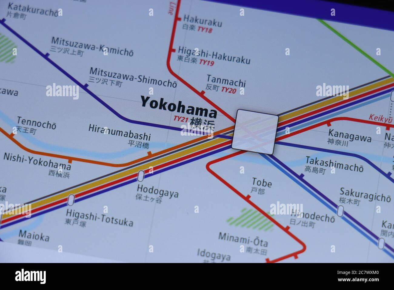 Yokohama Station on Tokyo subway map on smartphone screen. Stock Photo