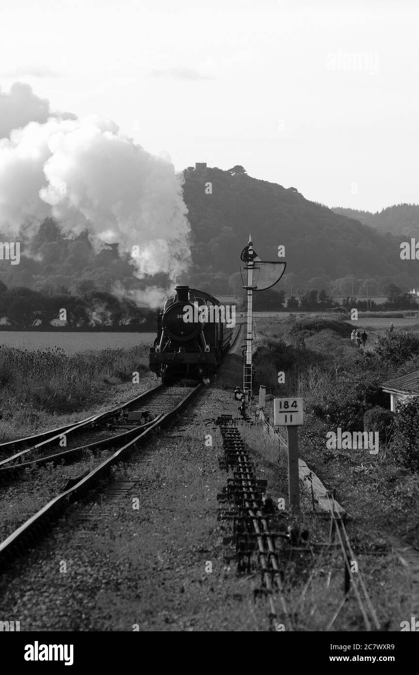 '3850' and 'Raveningham Hall' approaching Blue Anchor with a Minehead - Bishops Lydeard train. Stock Photo