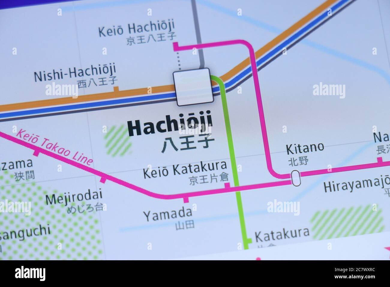 Hachioji Station on Tokyo subway map on smartphone screen. Stock Photo