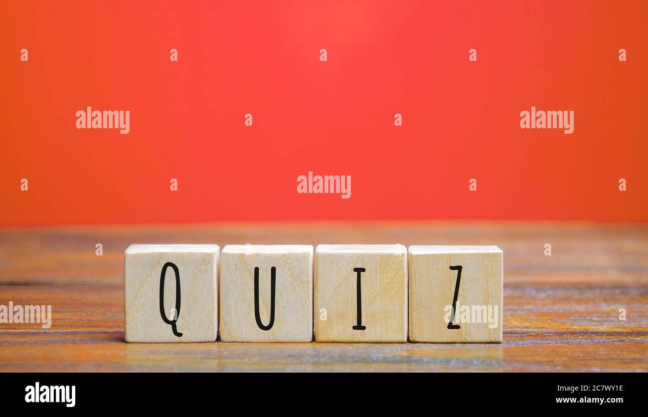 Wooden blocks with the word Quiz. Business or education concept. Answers to oral or written questions from various fields of knowledge. Stock Photo