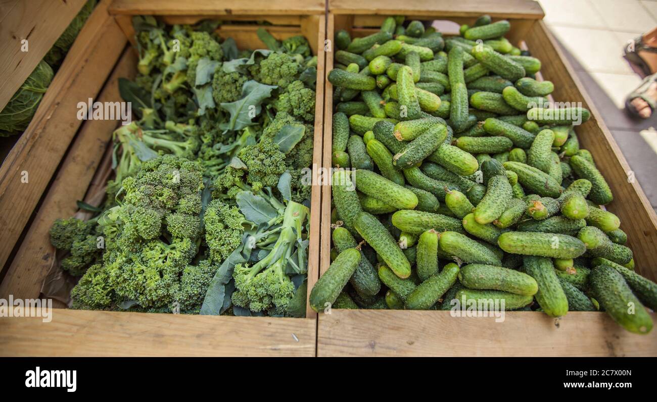 Vegetables in the wooden boxes for sale in the market Stock Photo - Alamy