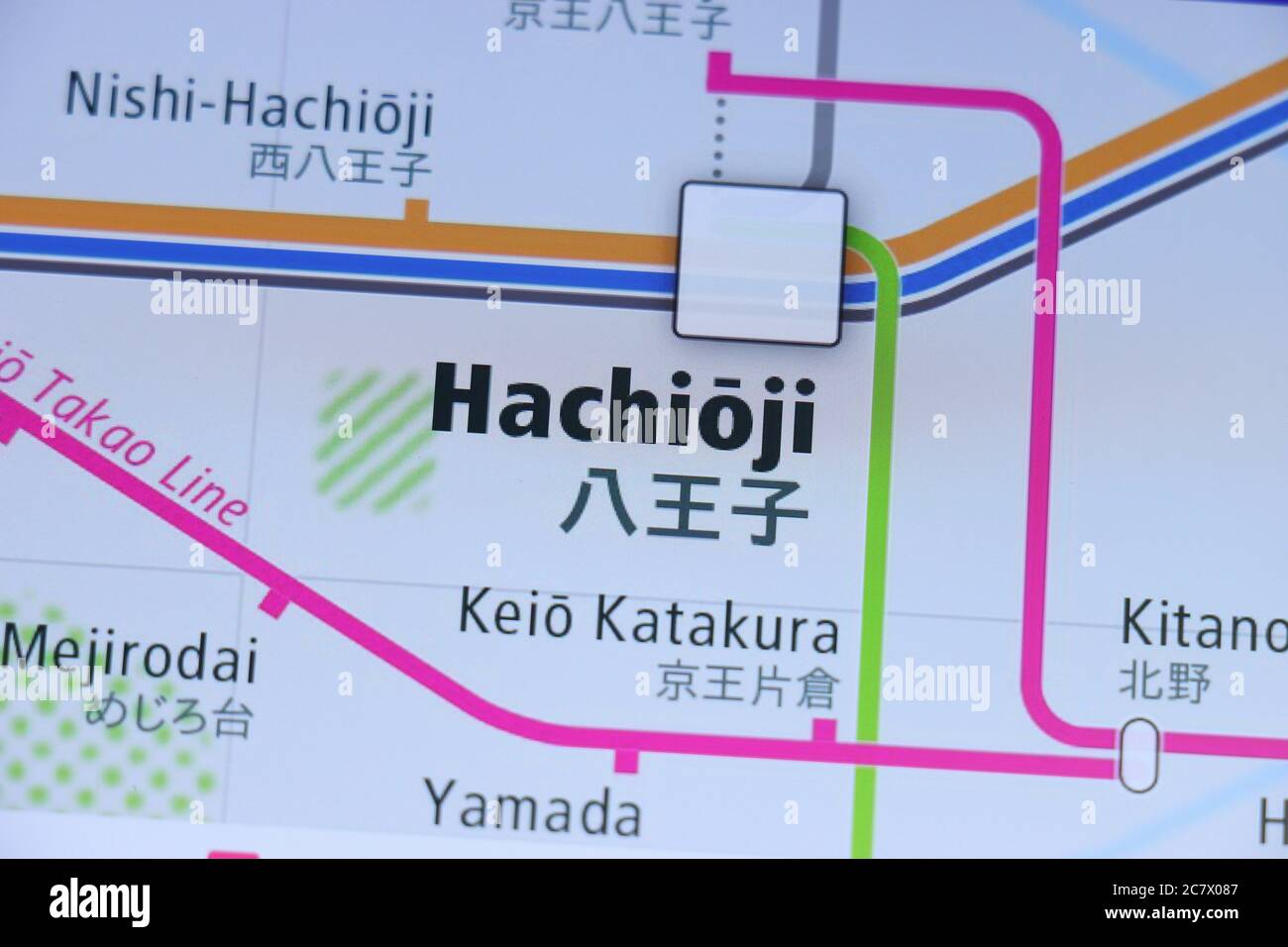 Hachioji station on Tokyo subway map on smartphone screen. Stock Photo