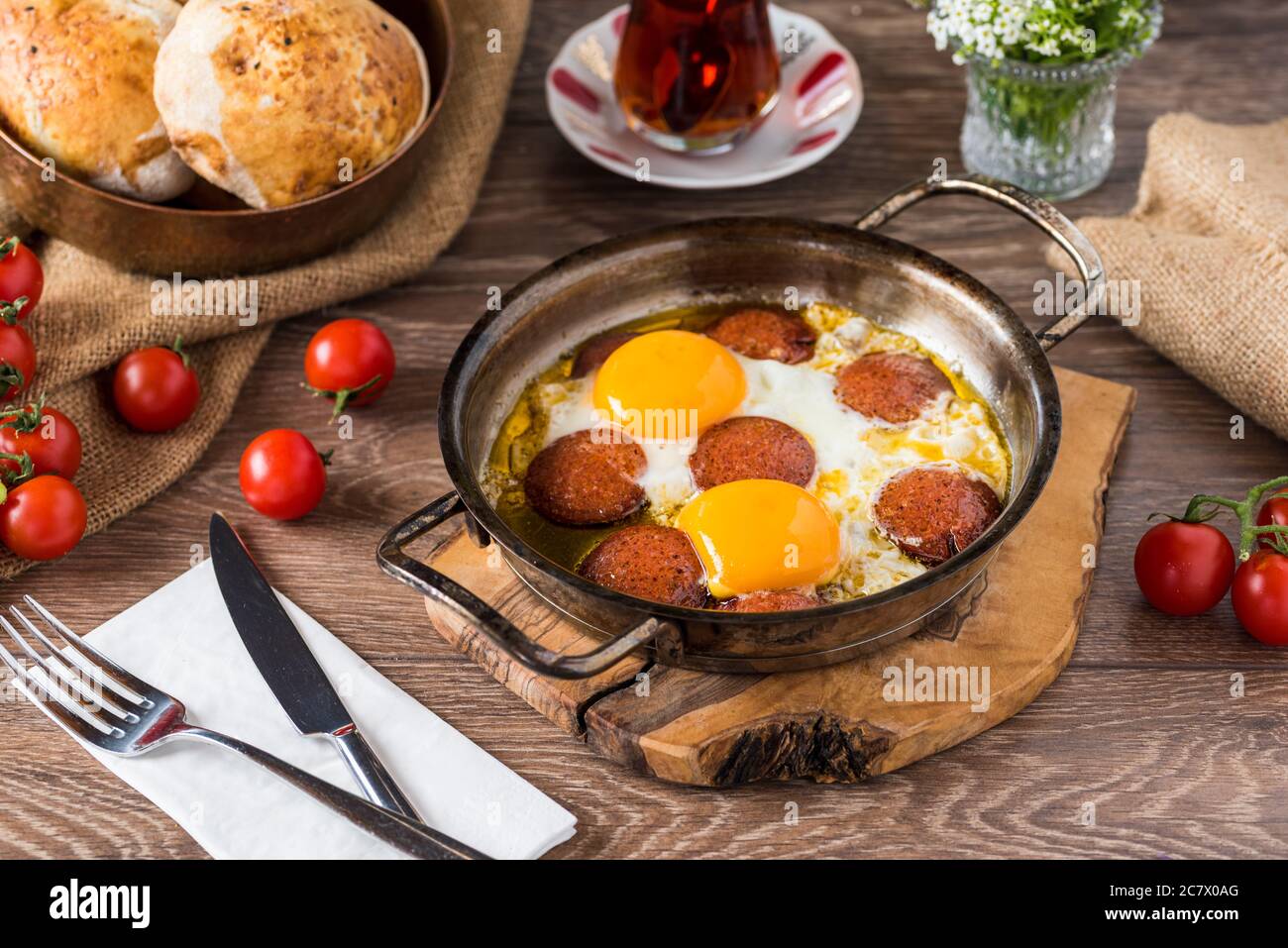 Traditional Turkish Breakfast Fried Egg with Turkish sausage. Bread
