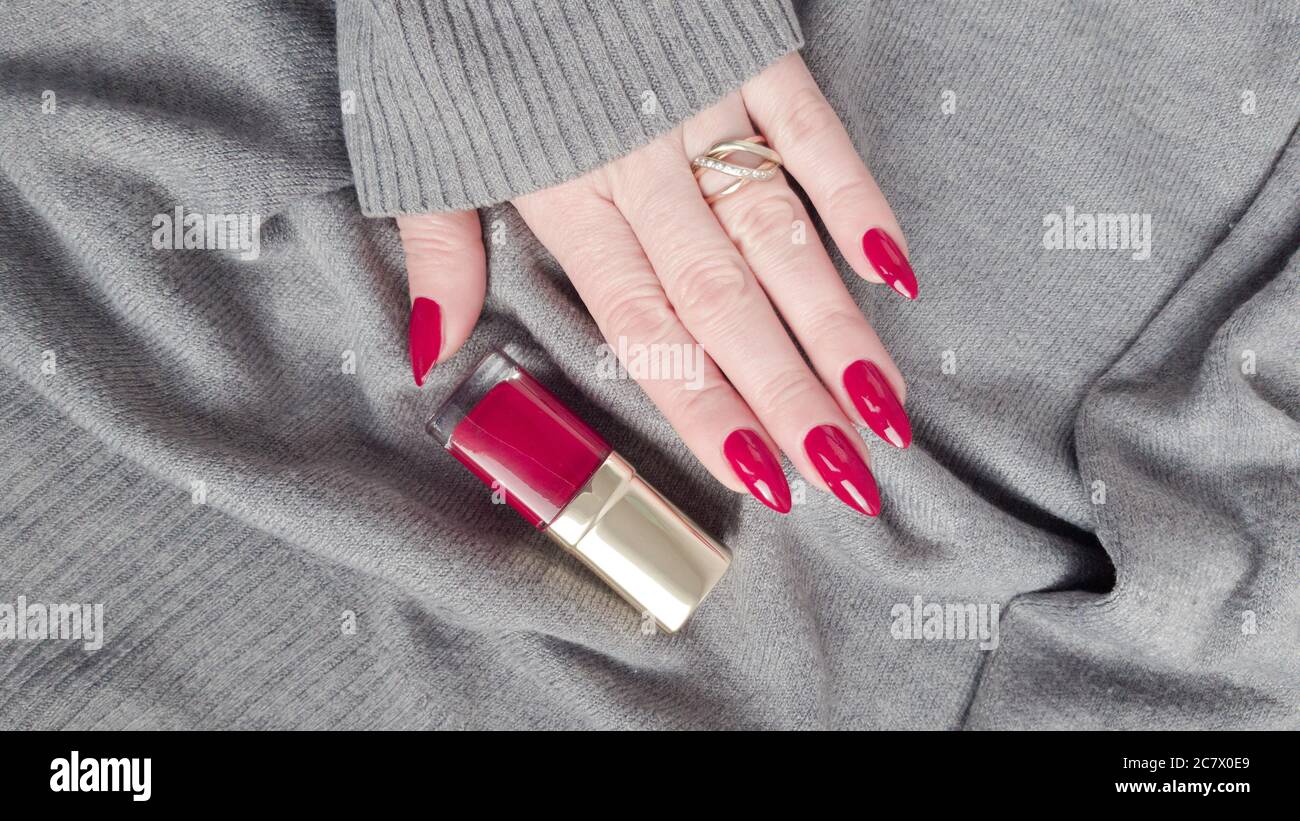 Female hand with long nails and a bottle of dark red nail polish Stock Photo - Alamy Female hand with long nails and a bottle of dark red nail polish Stock Photo - Alamy