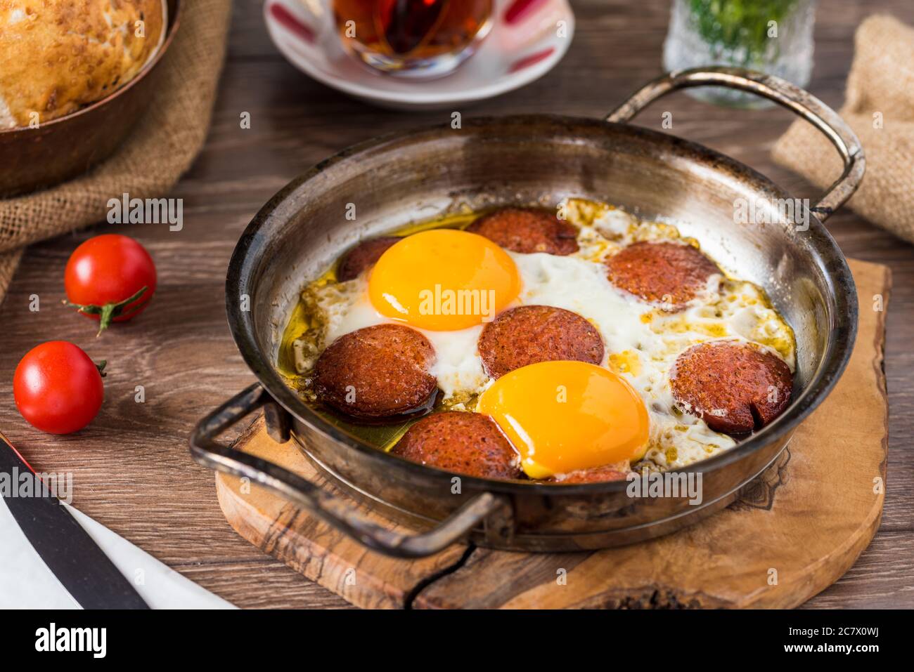 Traditional Turkish Breakfast Fried Egg with Turkish sausage. Bread