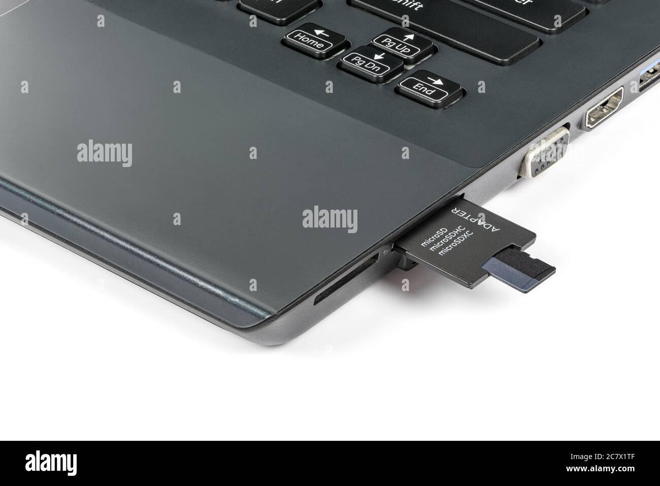 Memory card inserting into adapter and laptops card reader isolated on