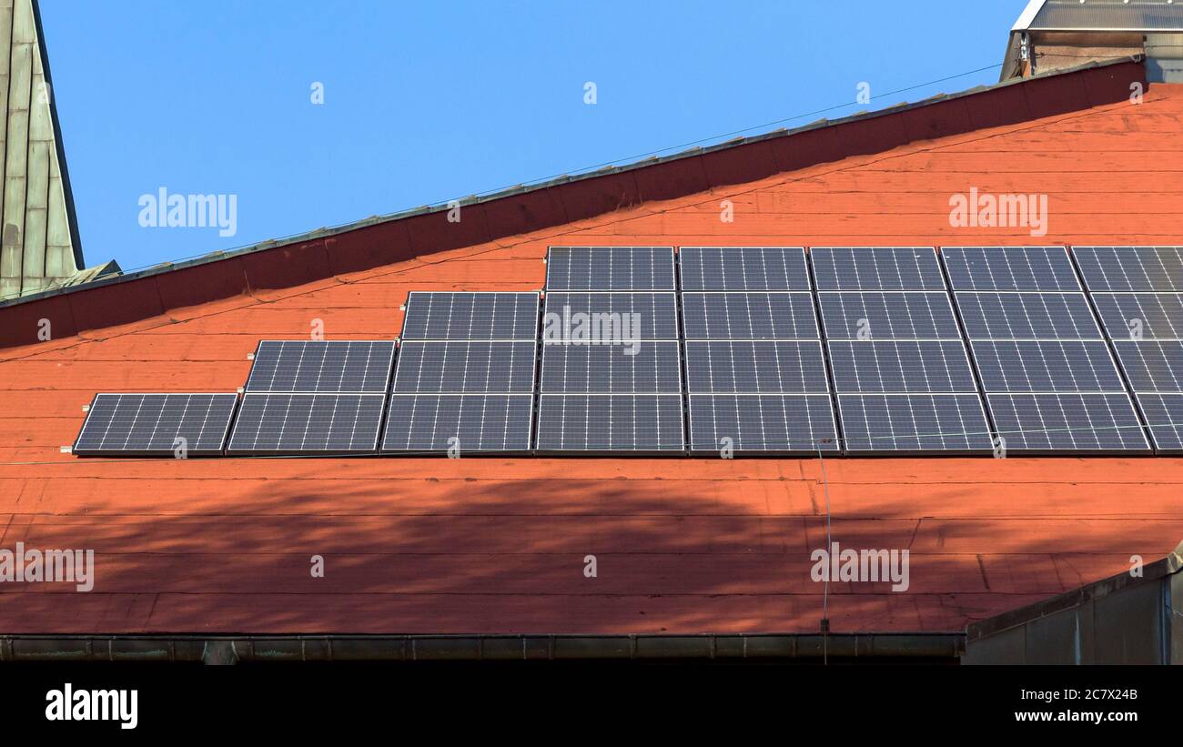 View of the solar panels in a rows installed on the roof Stock Photo ...