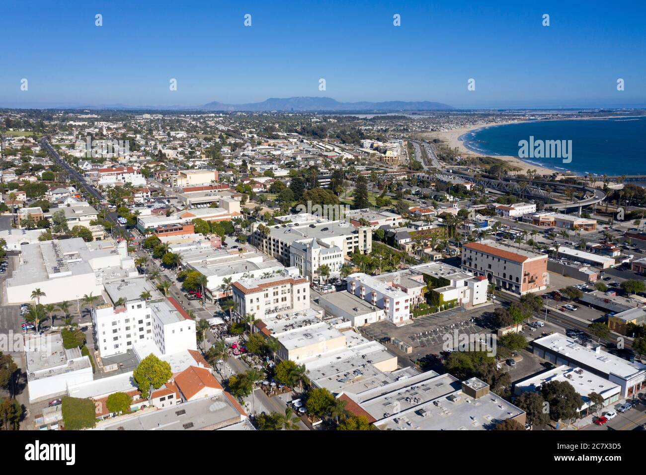 Aerial view over downtown Ventura, California with the blue Pacific Ocean coast Stock Photo