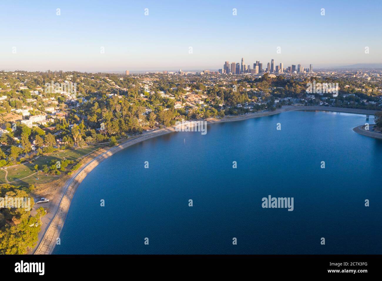 Aerial view of Silver Lake Reservoir with downtown Los Angeles skyline