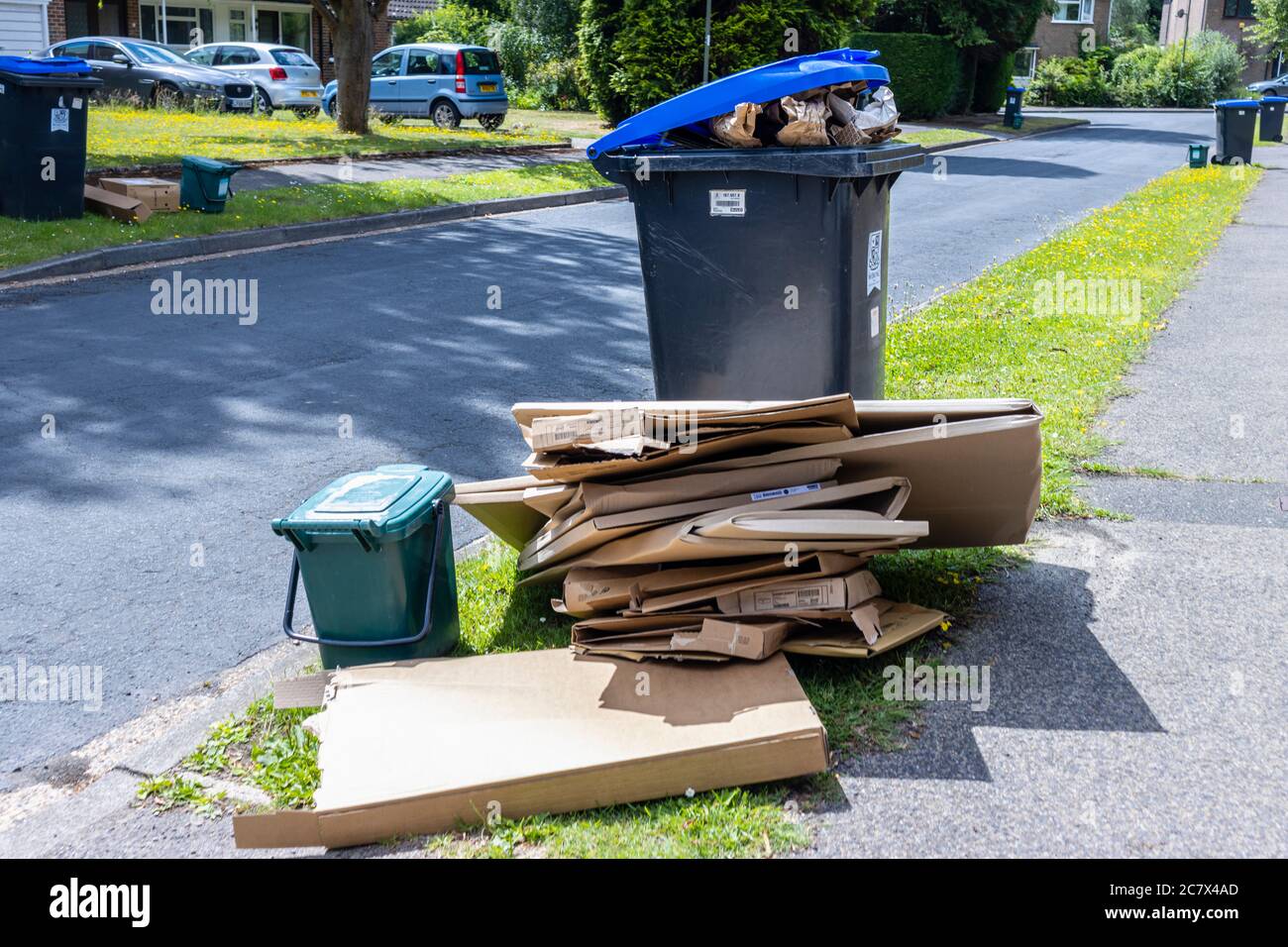 Overflowing recycling waste bins hires stock photography and images
