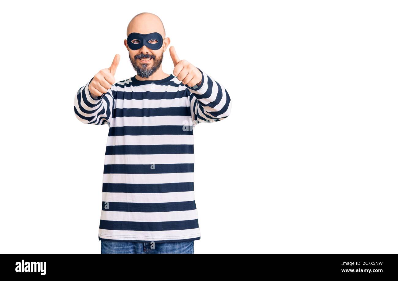 Crime thumbs up smiling hi-res stock photography and images - Alamy