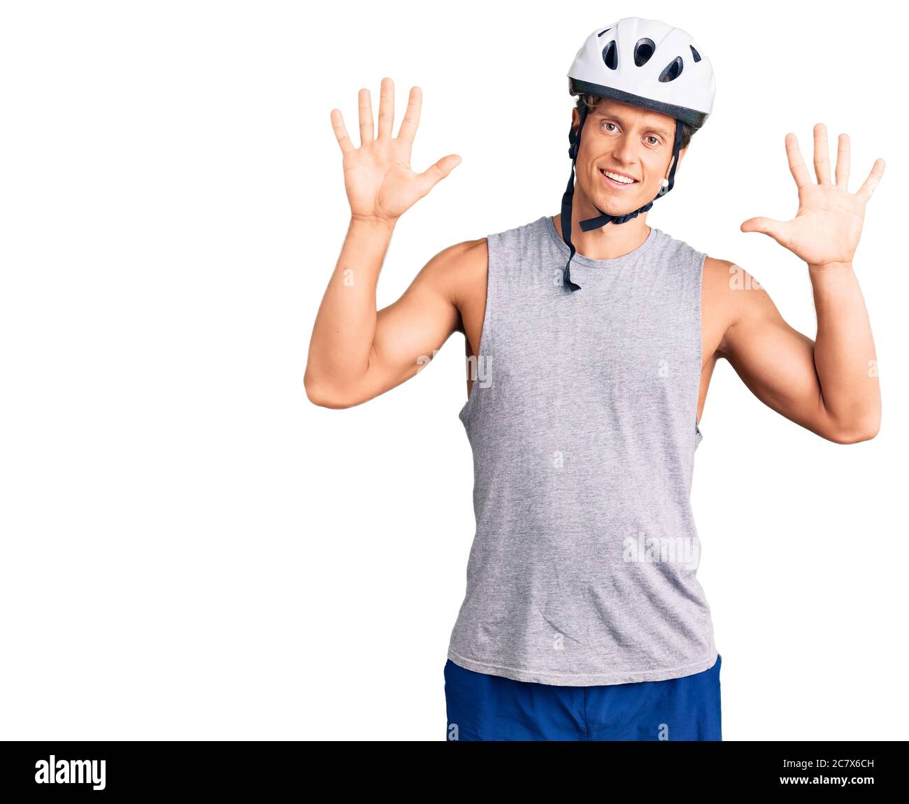 Young Handsome Man Wearing Bike Helmet Showing And Pointing Up With