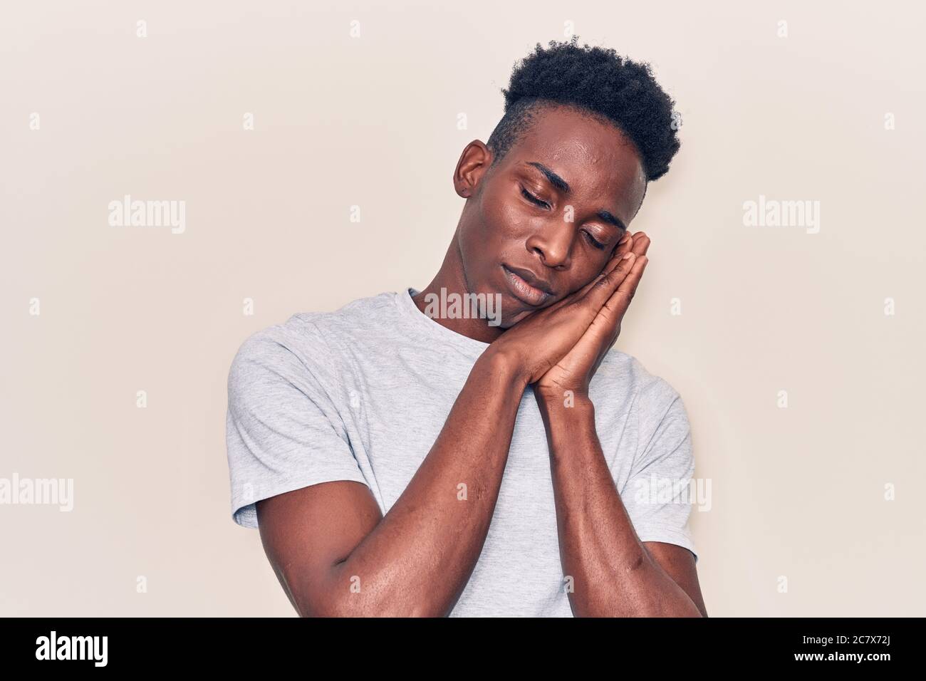 Young african american man wearing casual clothes sleeping tired ...