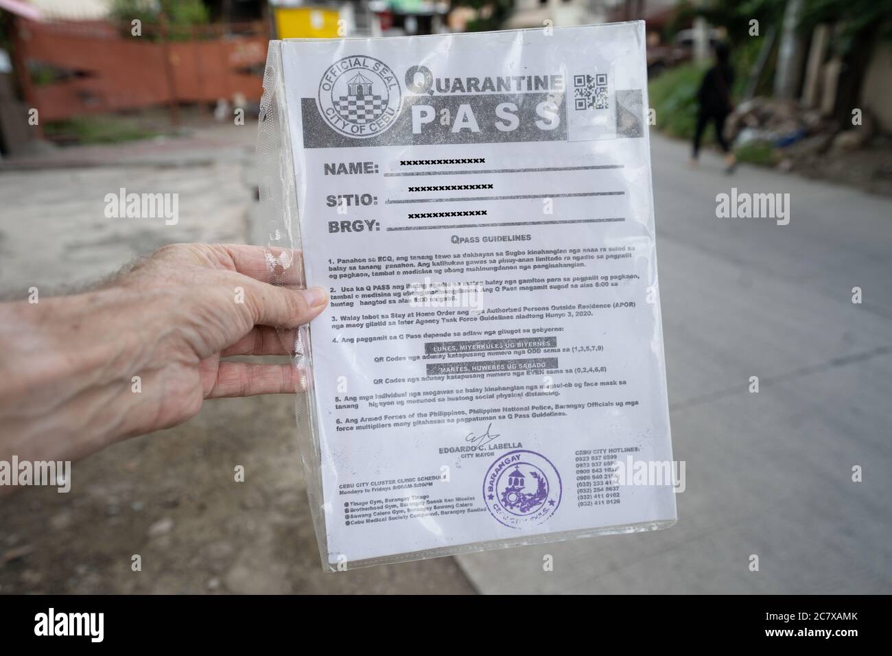 An Enhanced Community Quarantine Pass issued by the local Government to residents within Cebu City during COVID-19 outbreak 2020. Stock Photo