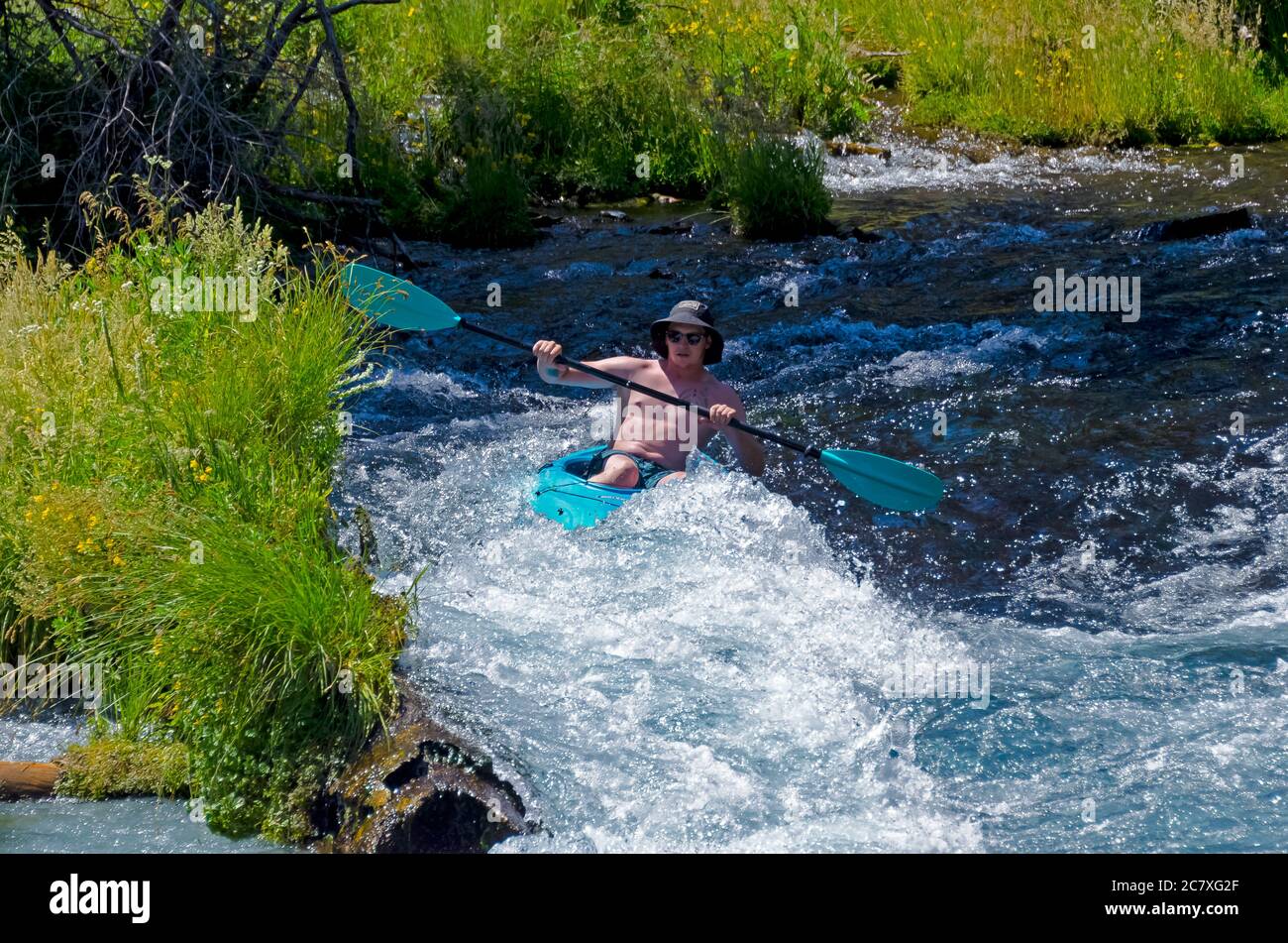 Kayak tipping over while going over the rapids Stock Photo Alamy