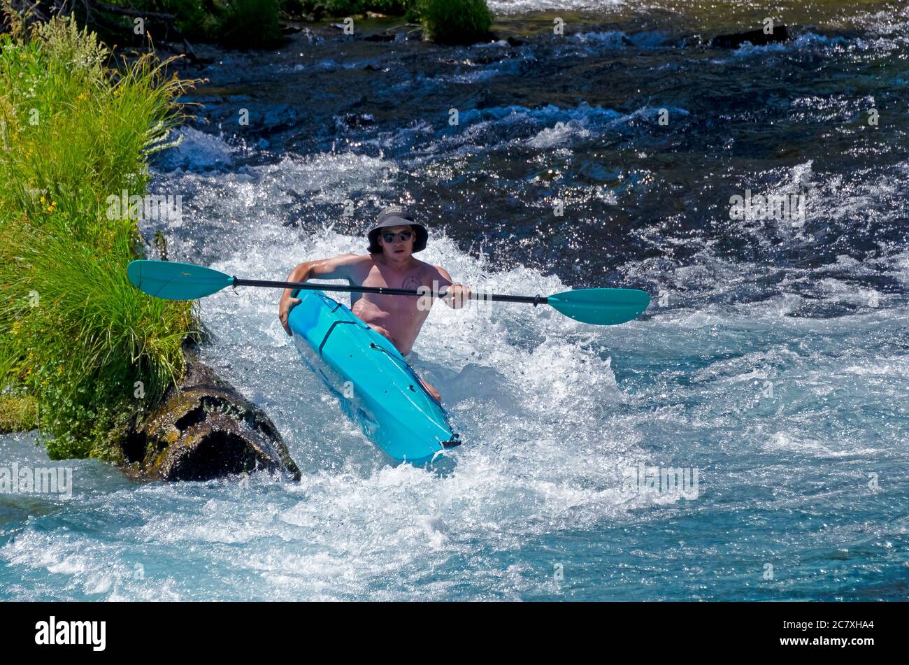 Kayak tipping over while going over the rapids Stock Photo Alamy