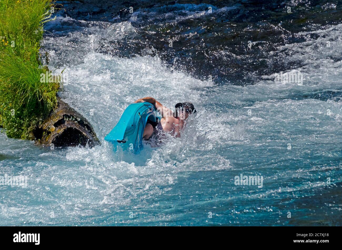 Kayak tipping over while going over the rapids Stock Photo Alamy