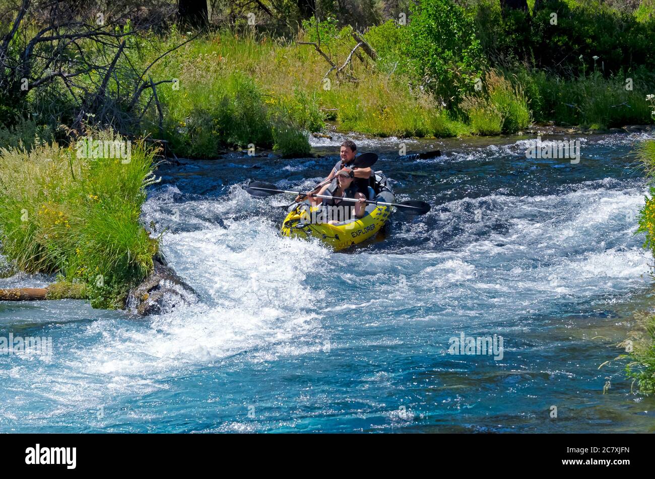Kayak tipping over while going over the rapids Stock Photo Alamy