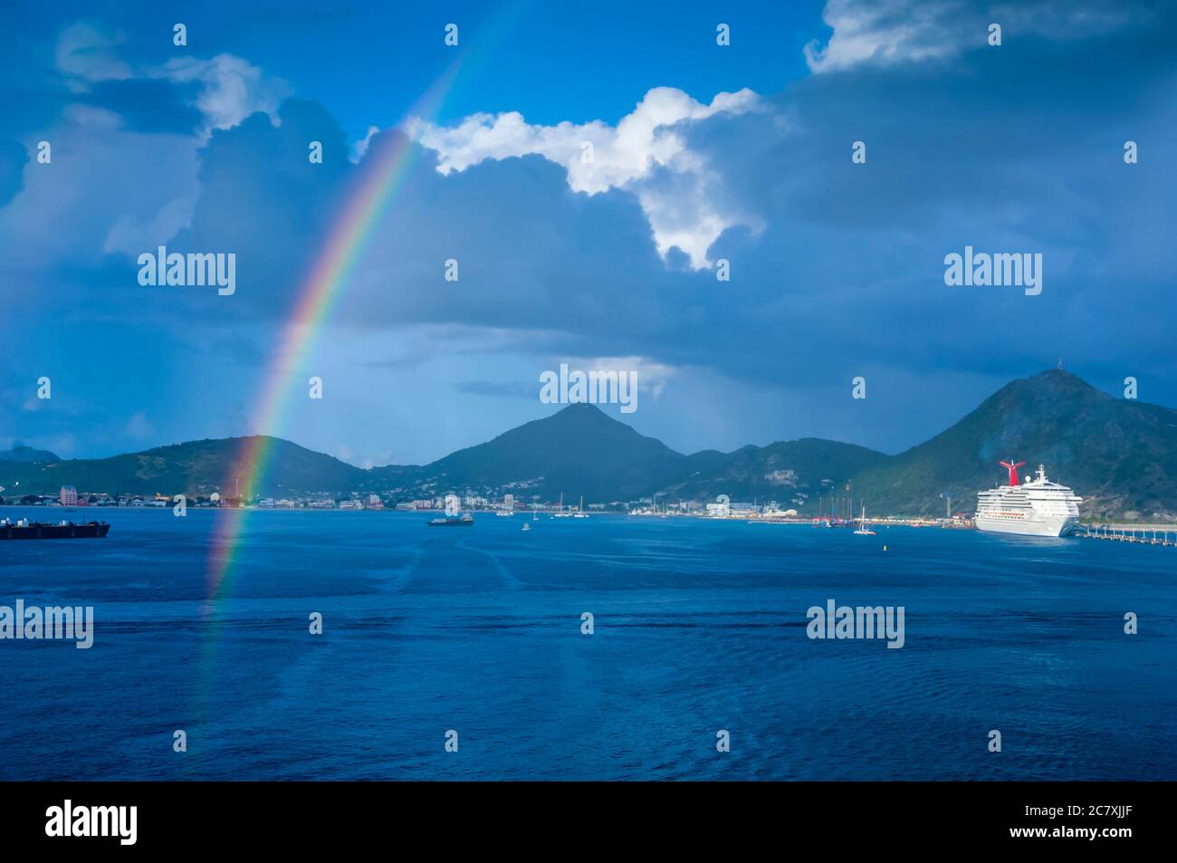 Storm clouds and rainbow near St. Maarten, Caribbean Islands. Stock Photo