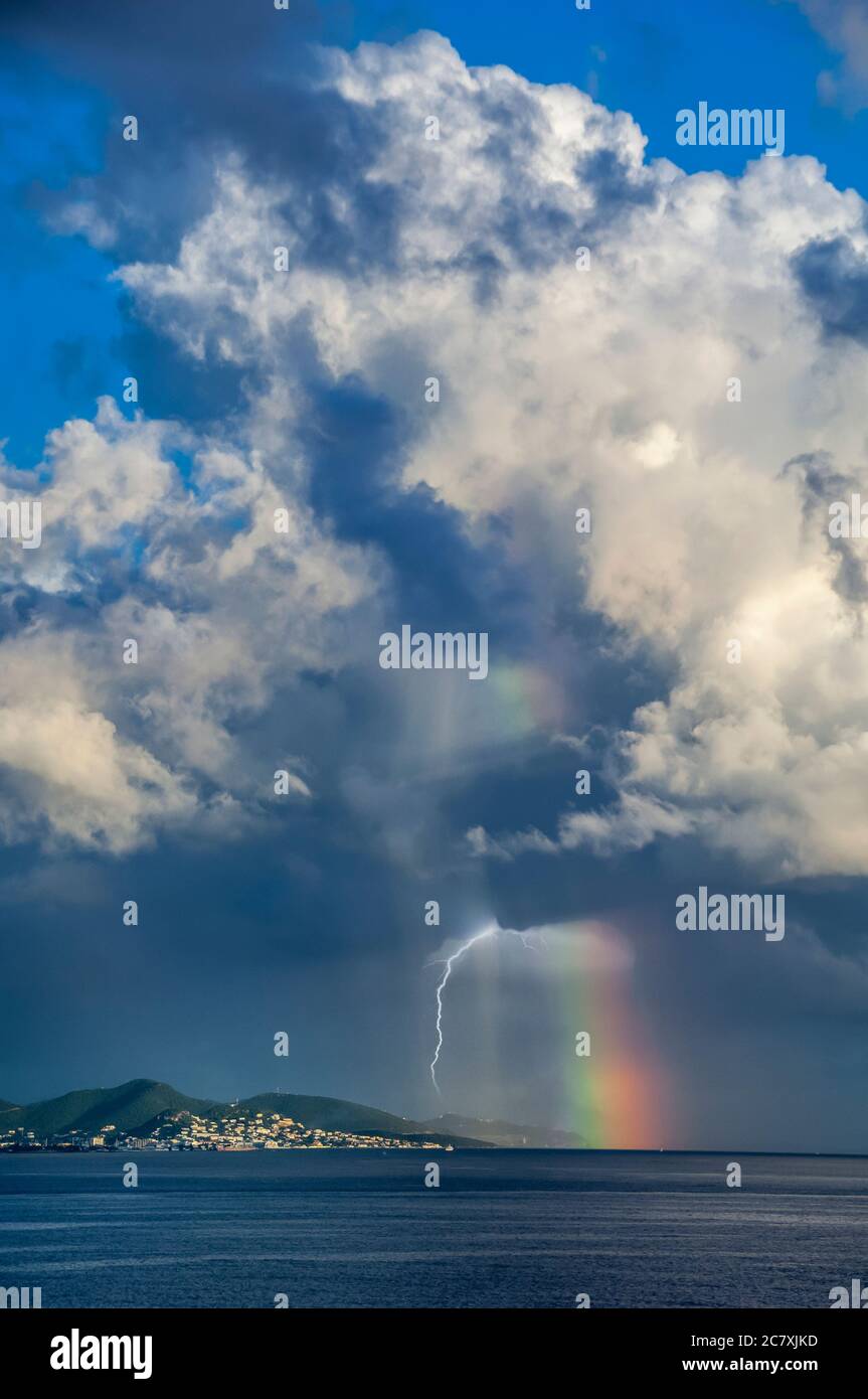 Storm clouds and rainbow near St. Maarten, Caribbean Islands. Stock Photo