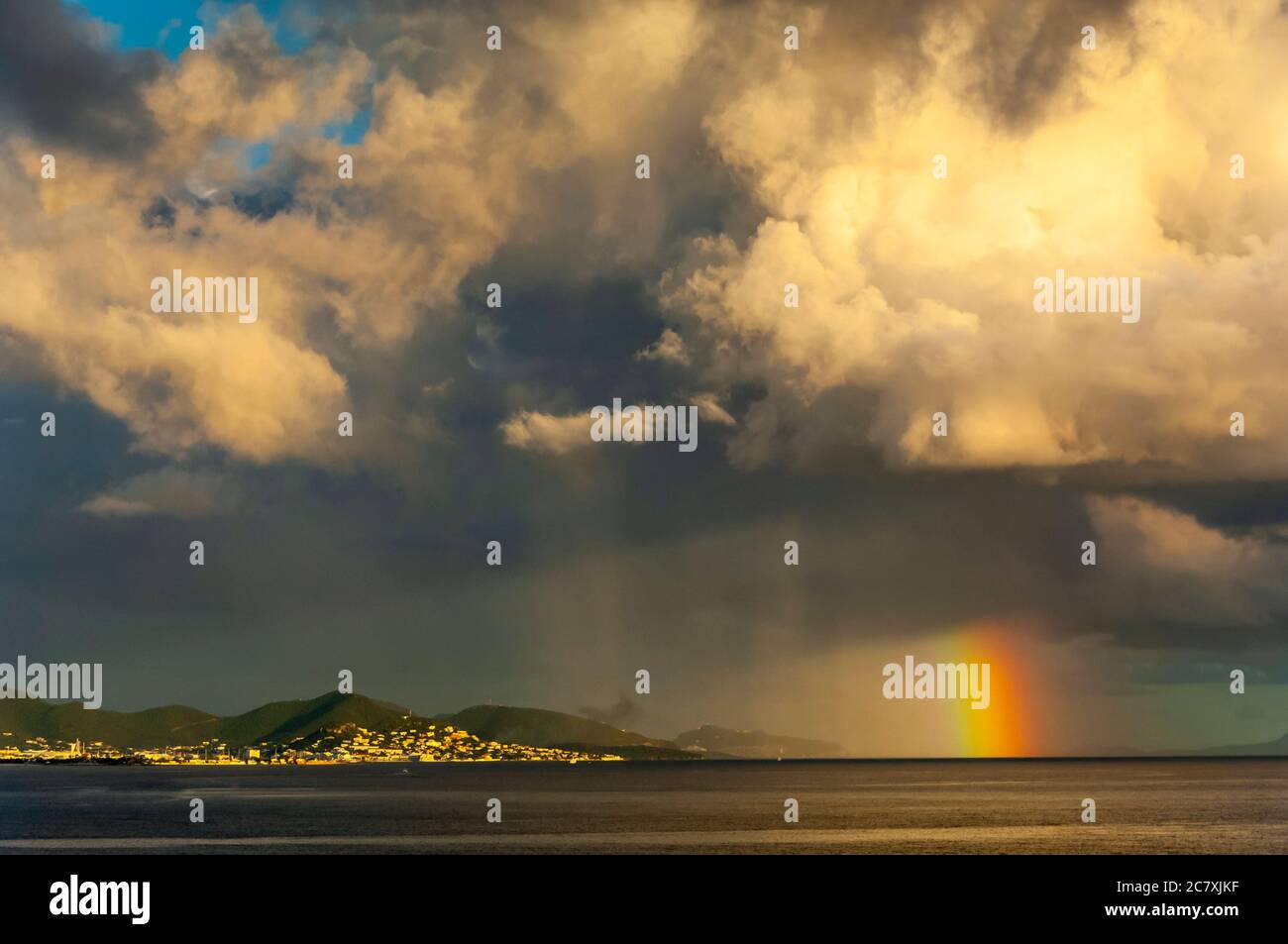 Storm clouds and rainbow near St. Maarten, Caribbean Islands. Stock Photo