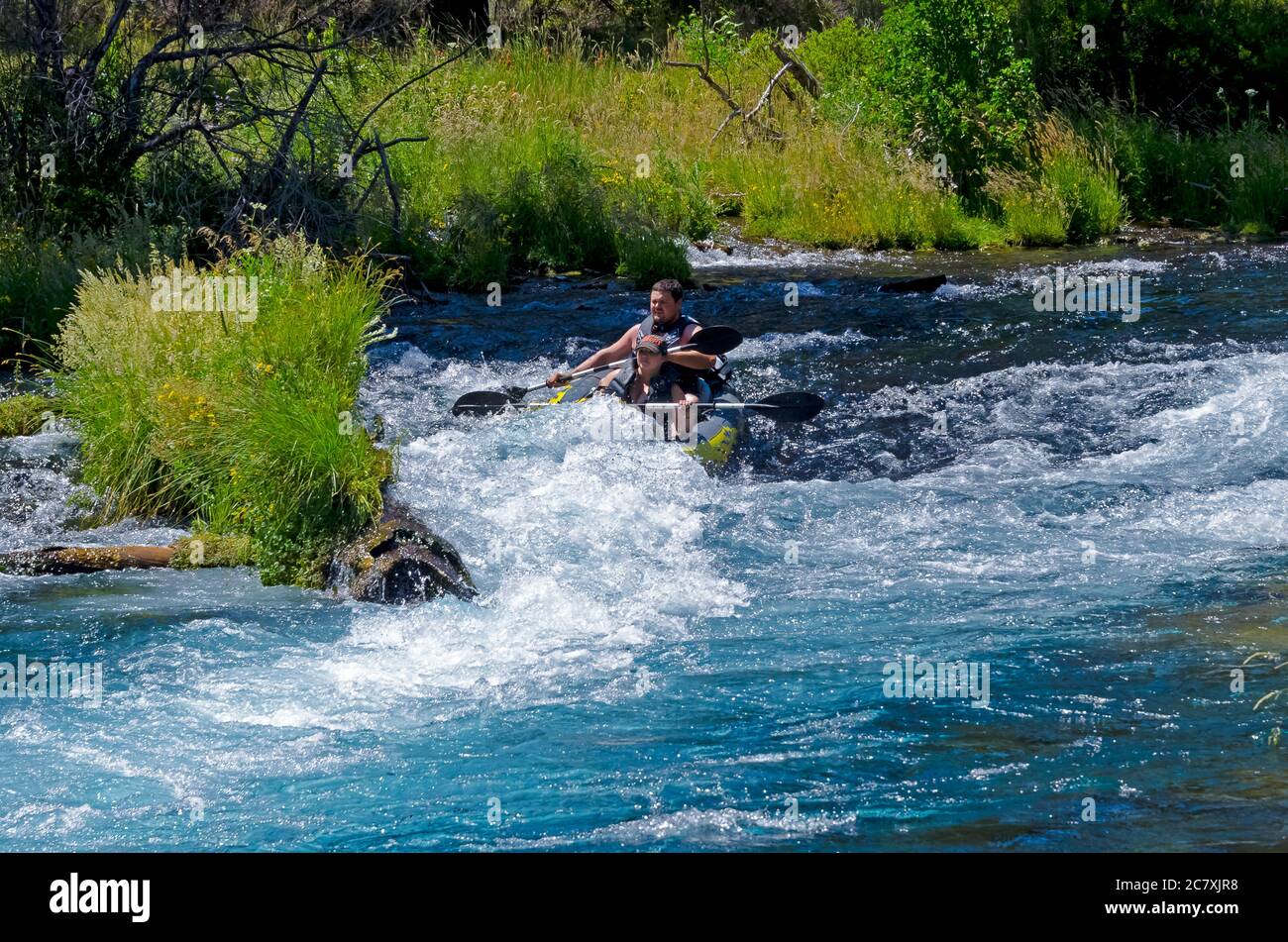 Kayak tipping over while going over the rapids Stock Photo Alamy