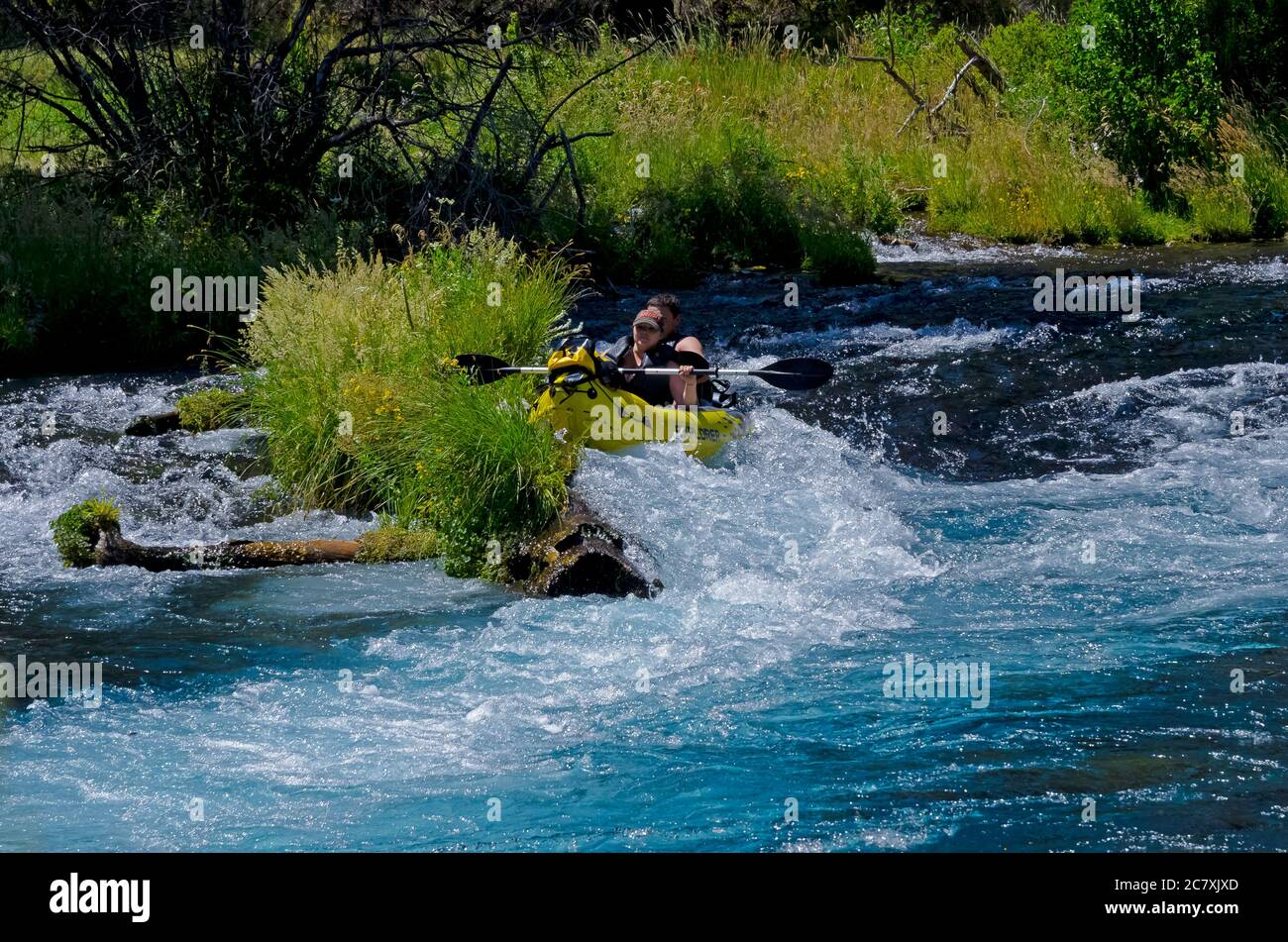 Kayak tipping over while going over the rapids Stock Photo Alamy
