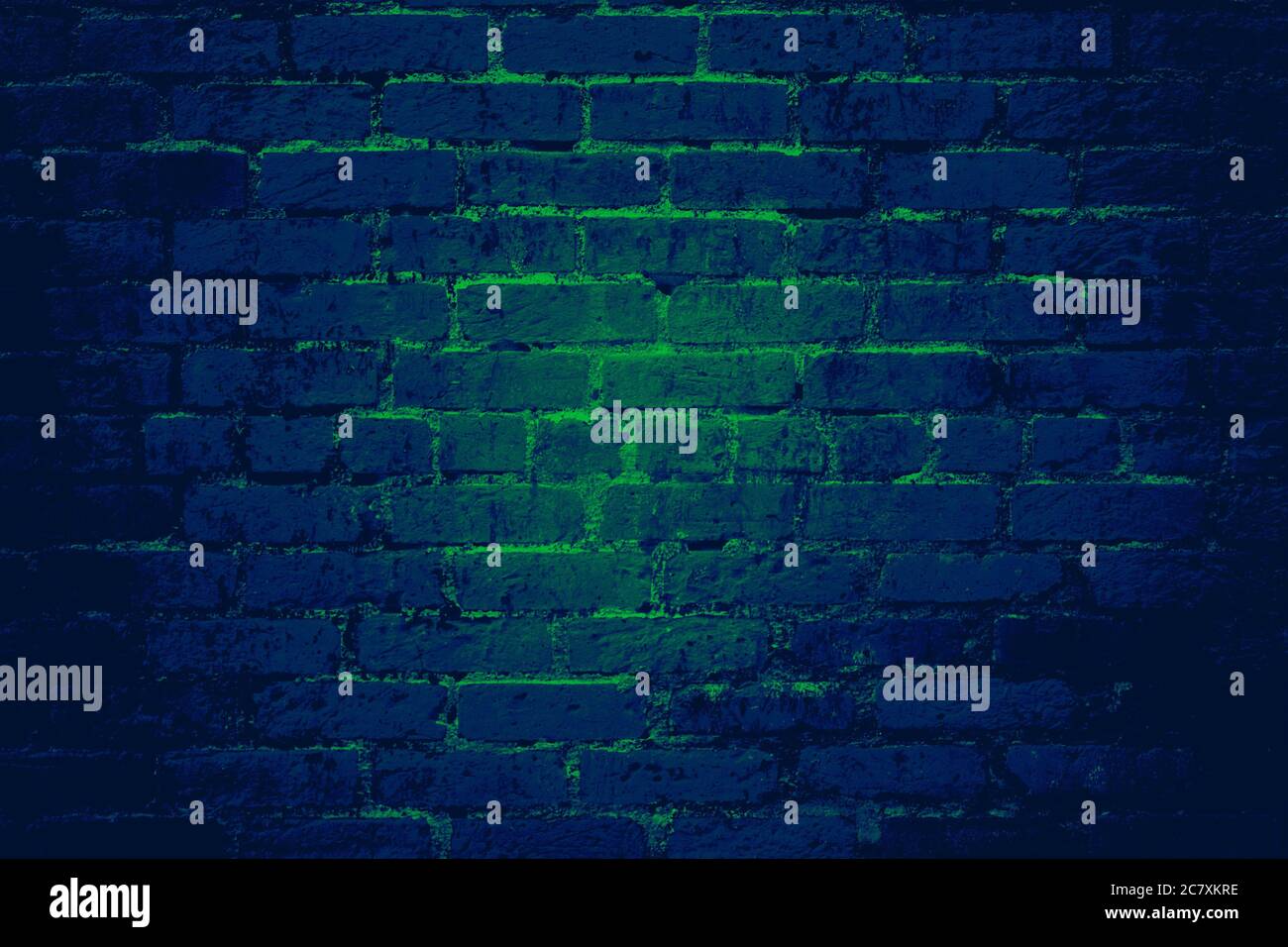 Blue brick wall background texture with glowing green light shining ...