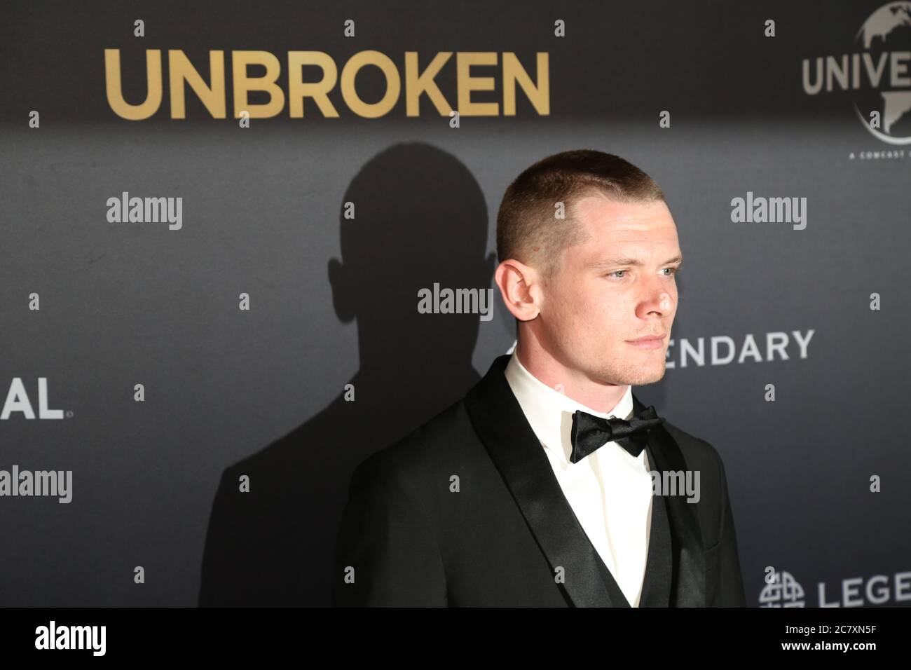 Jack O’Connell who plays the lead character Louie Zamperini arrives on the red carpet for the world premiere of ‘Unbroken’ at the State Theatre, Marke Stock Photo