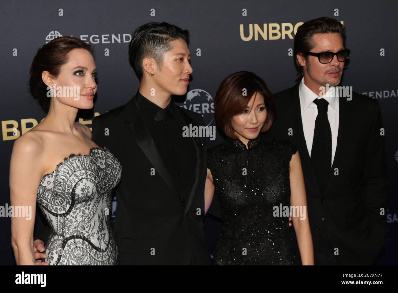 Unbroken producer and director Angelina Jolie with actor Miyavi, partner Melody Ishihara and Brad Pitt on the red carpet for the world premiere of ‘Un Stock Photo