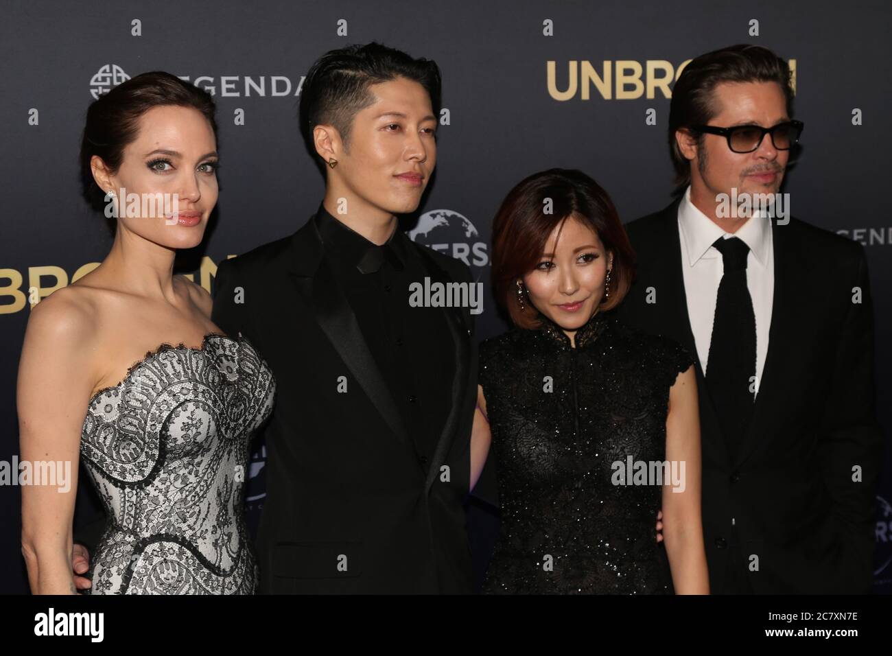 Unbroken producer and director Angelina Jolie with actor Miyavi, partner Melody Ishihara and Brad Pitt on the red carpet for the world premiere of ‘Un Stock Photo