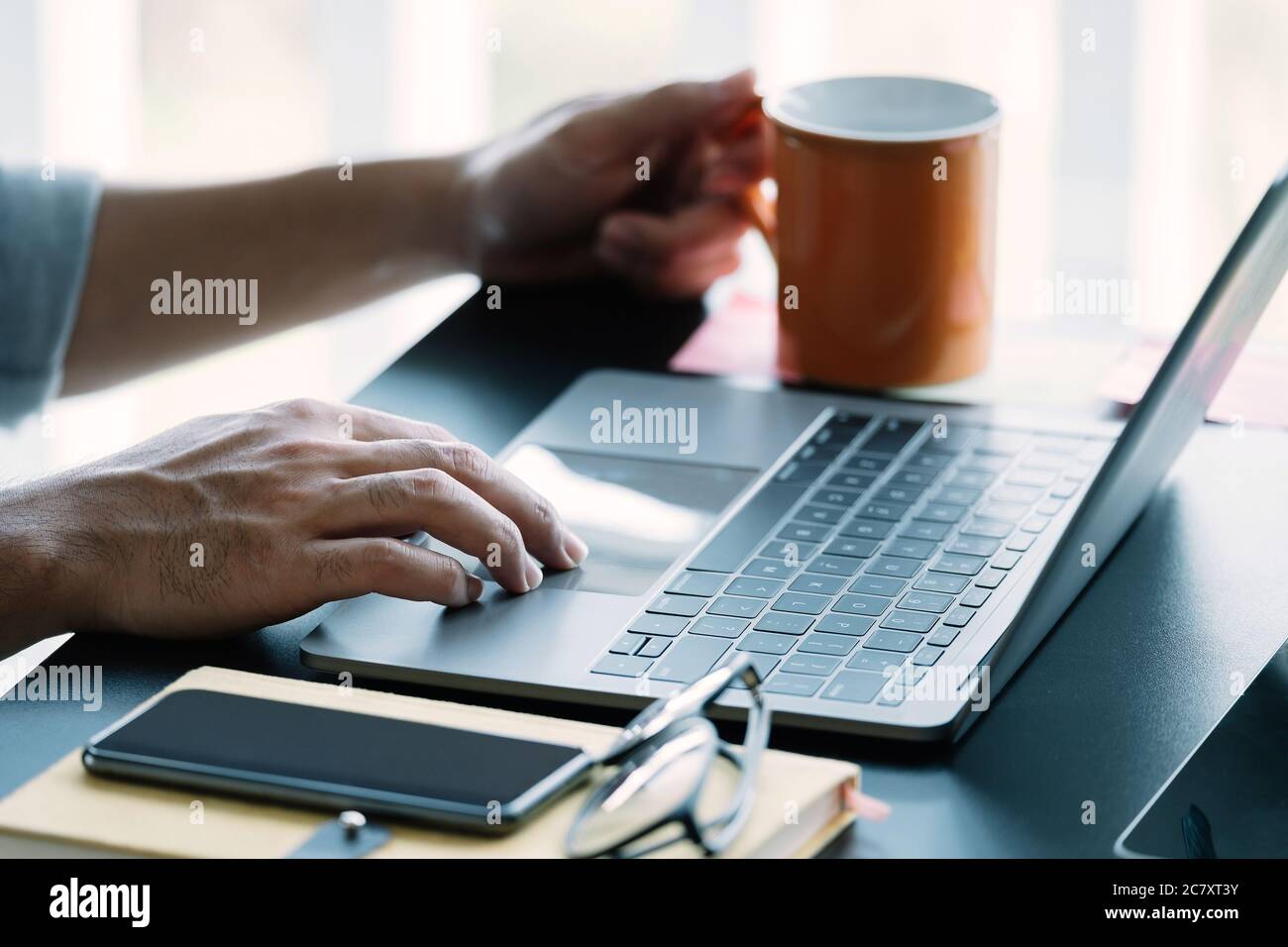 Close up man using smart laptop at home Stock Photo