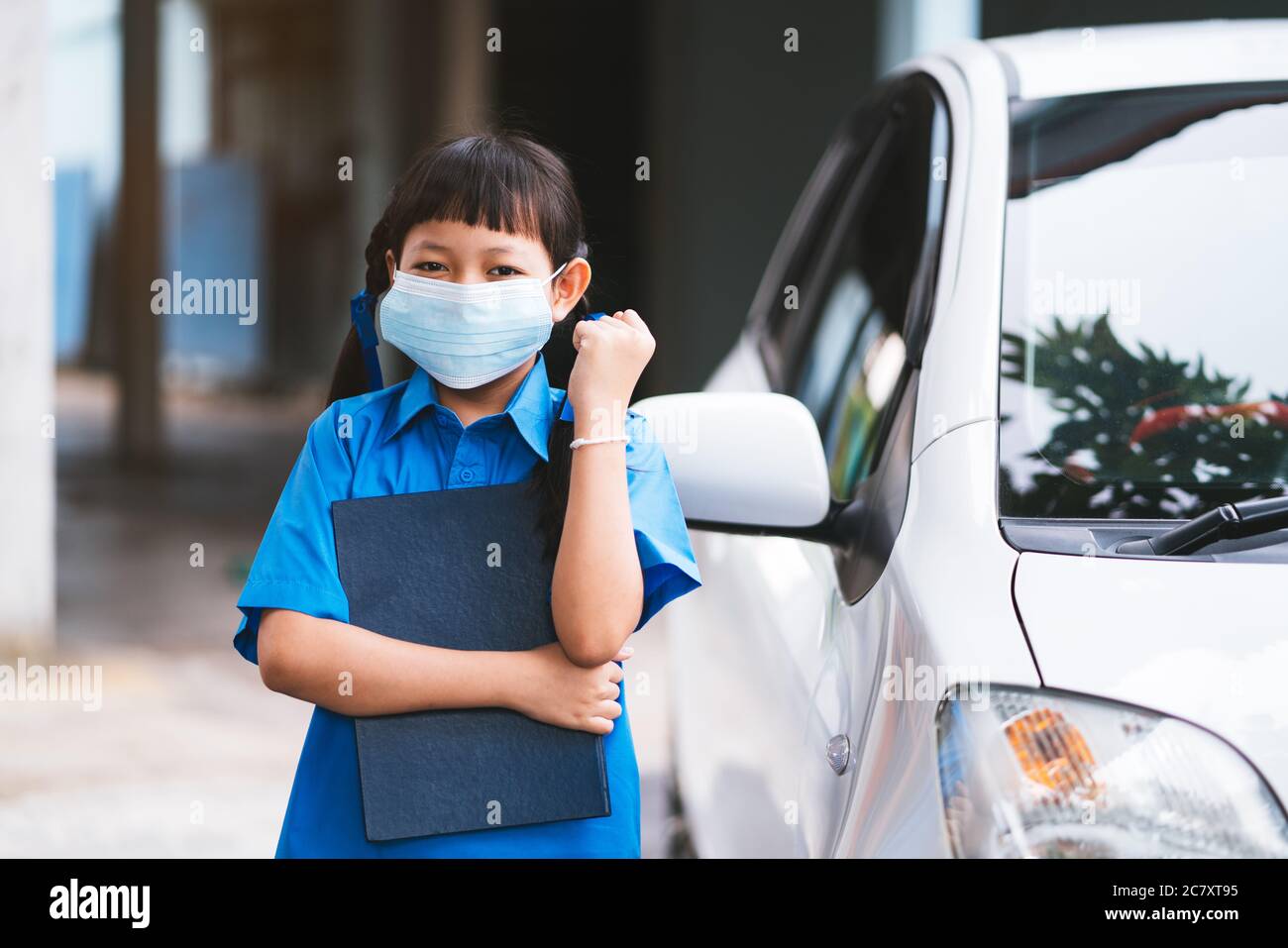 Asian uniform student wear face mask to protect Corona virus or Covid-19.Back to school concept Stock Photo