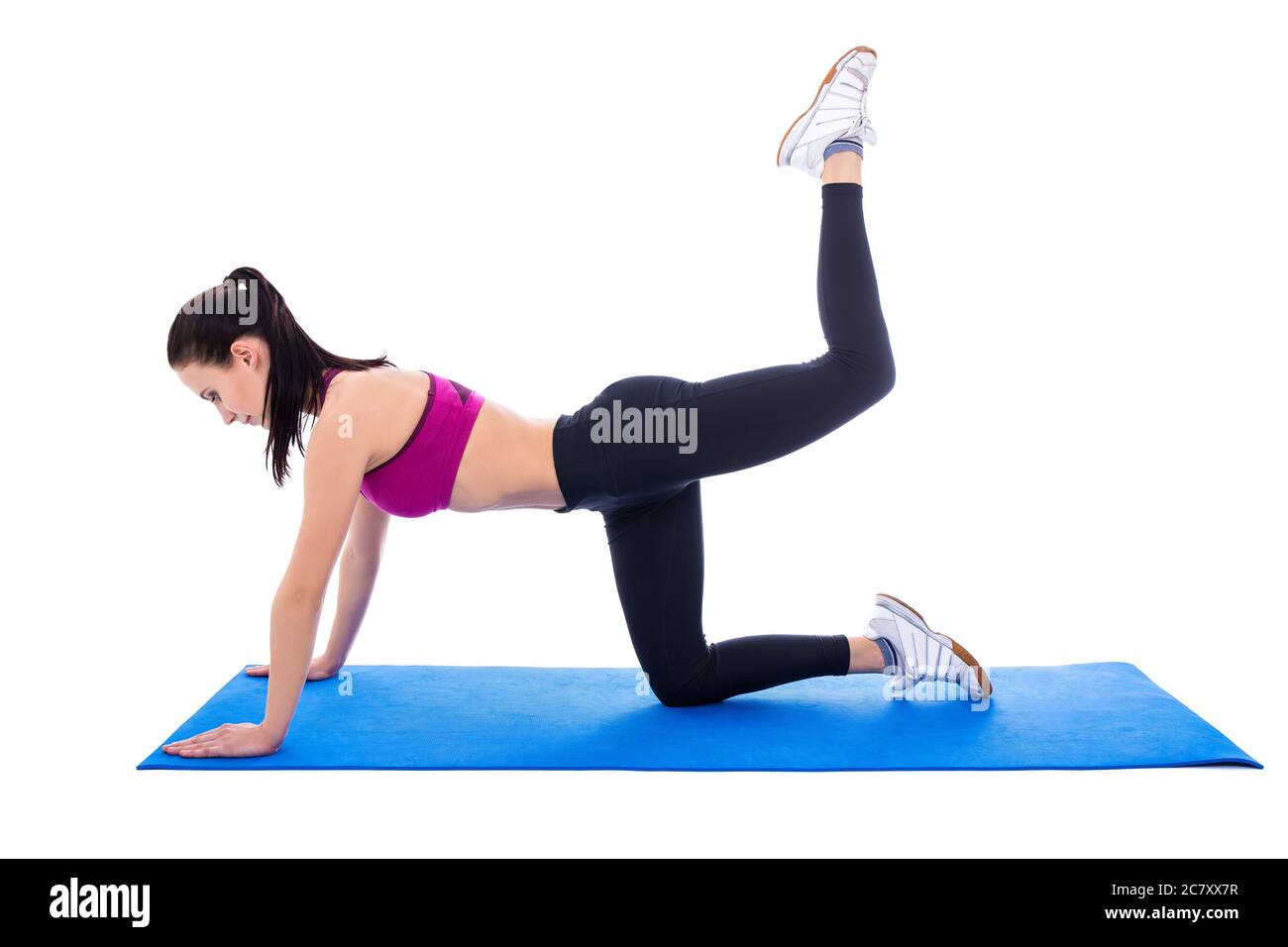 beautiful slim woman doing stretching exercises on yoga mat isolated on ...