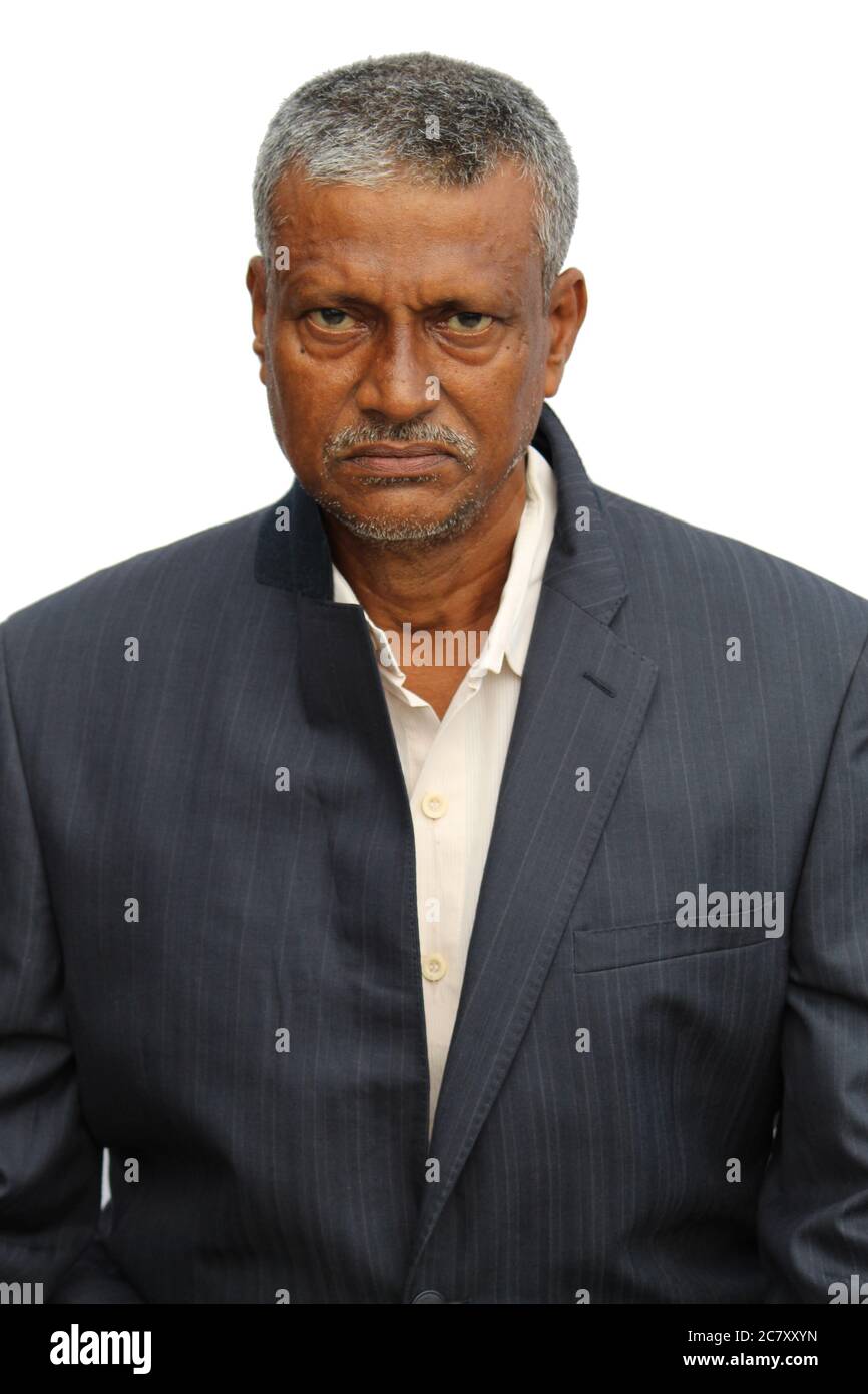 Senior Indian man cropped portrait view with angry or sad expression on white background. Stock Photo