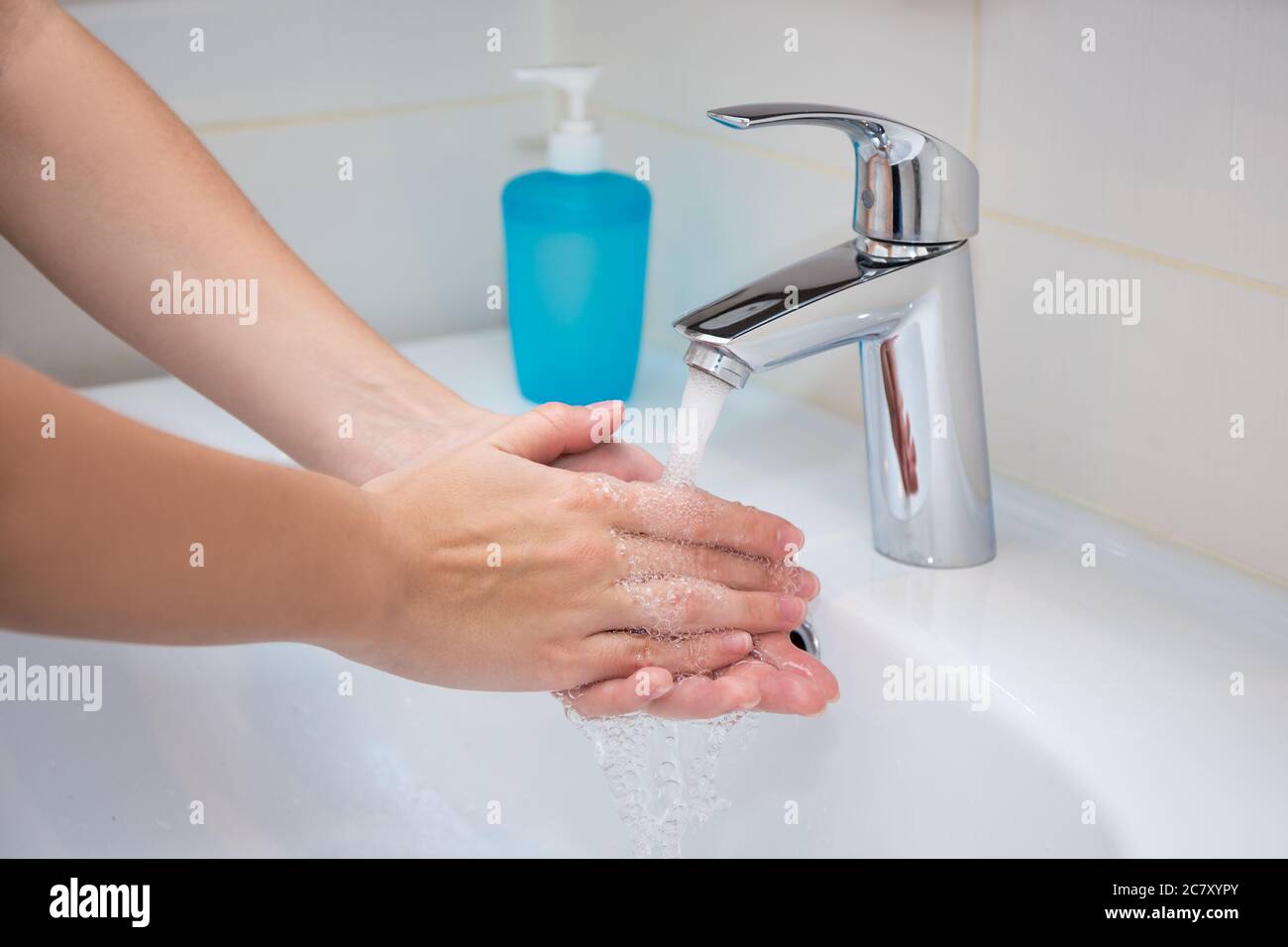 close up of woman washing hands with soap in bathroom Stock Photo - Alamy