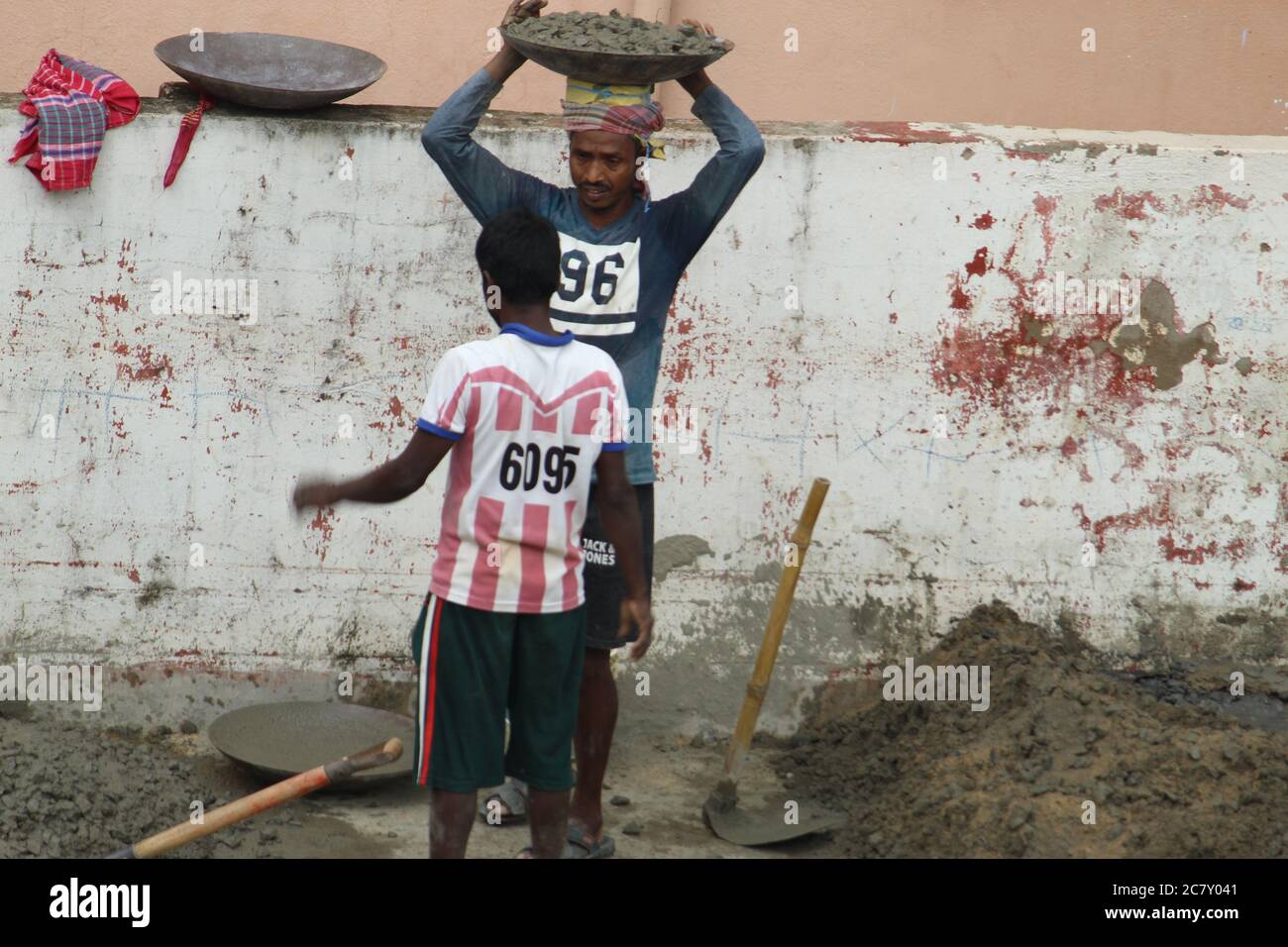 Kolkata, West Bengal/India - July, 2020:  Migrant and local labourers are working for construction industry at Barasat, N.24 Parganas. Stock Photo