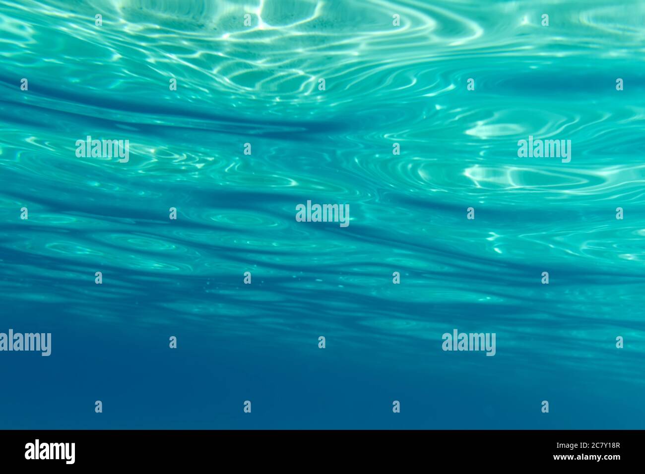 Summer time under the sea ocean water with a ray of sunlight from the surface for a background concept design Stock Photo