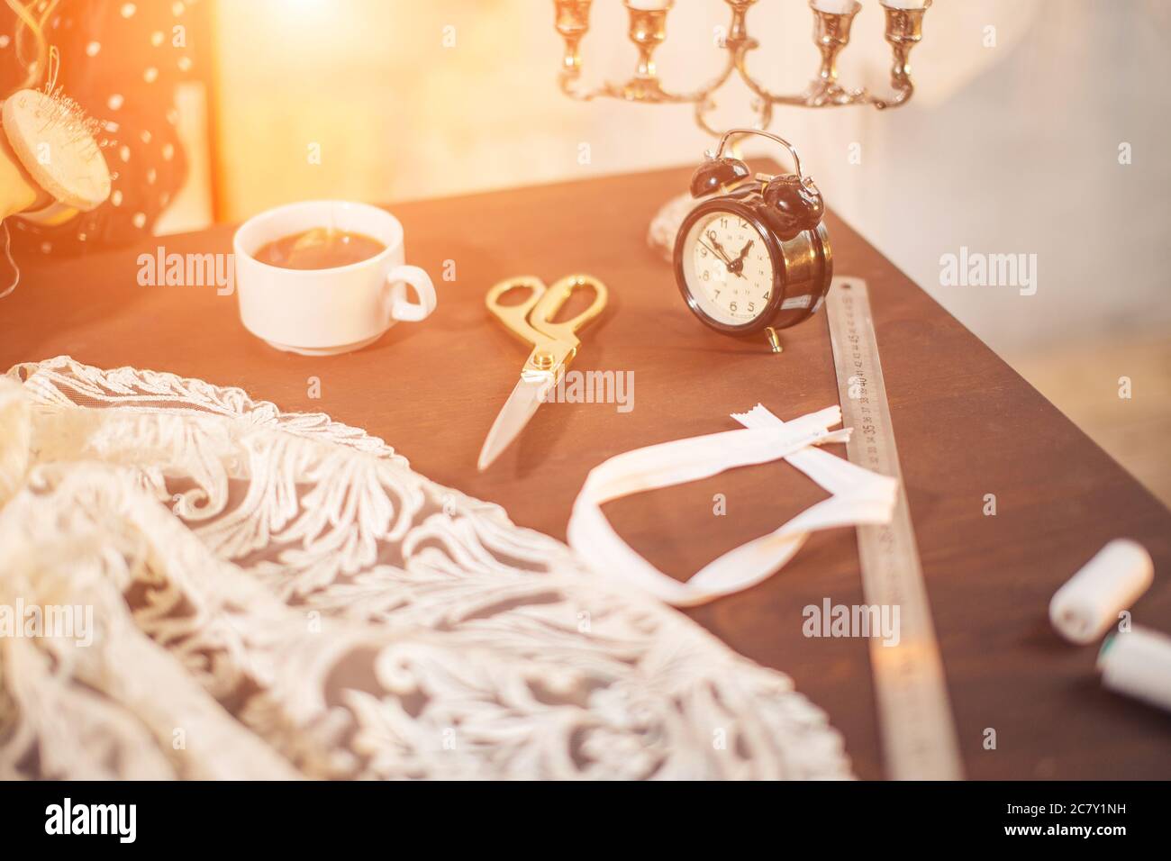 needlework, craft, sewing and tailoring concept - box with thread spools and buttons on table Stock Photo