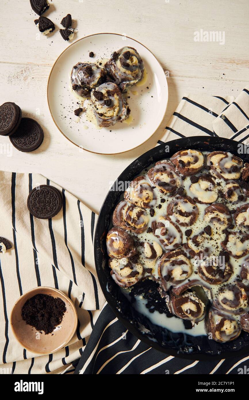 Delicious and sweet cinnamon rolls with white cream in a plate Stock ...
