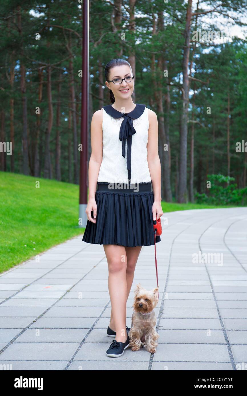 happy girl in school uniform walking with little dog Stock Photo - Alamy