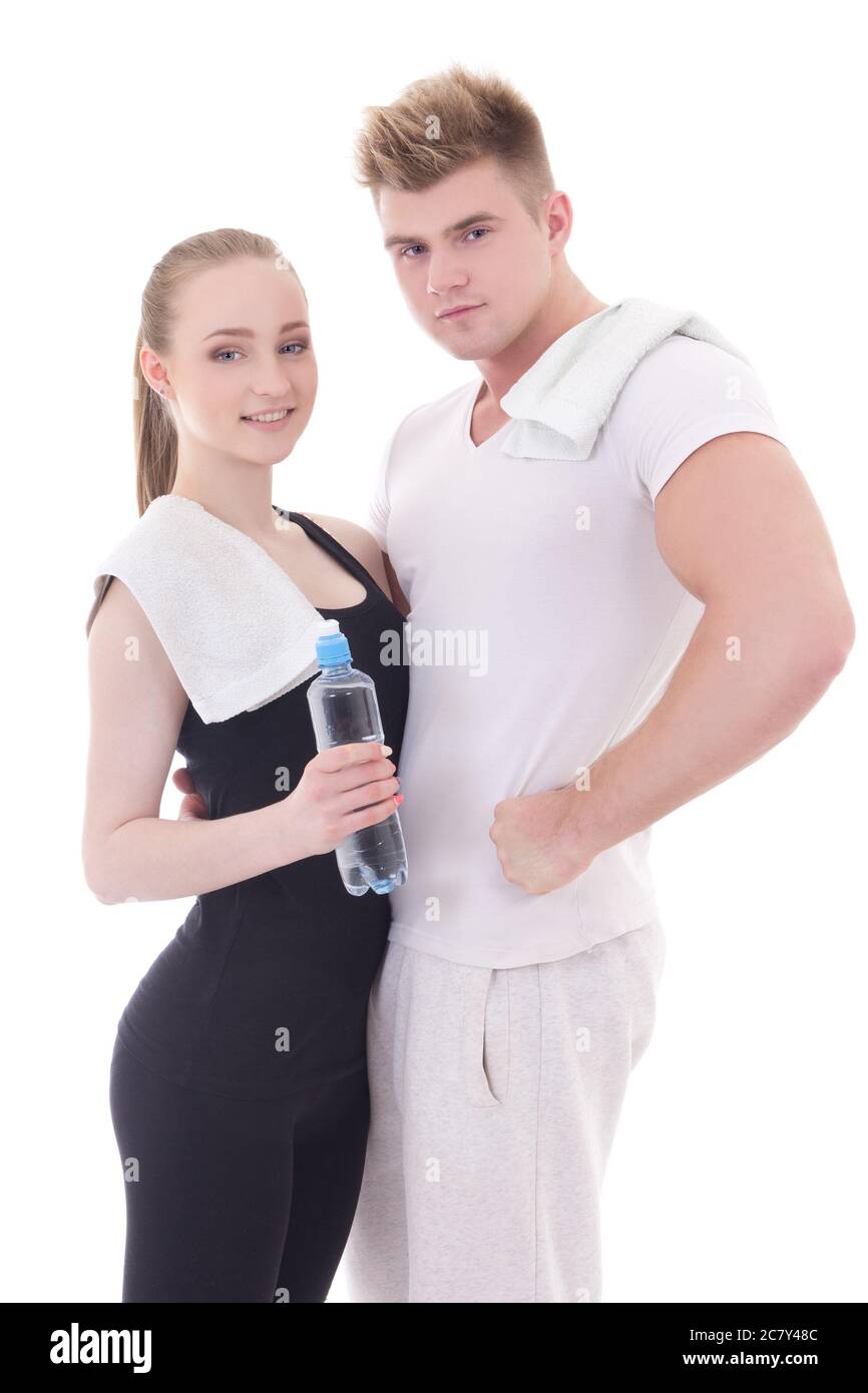 healthy lifestyle concept - young muscular man and slim woman with ...