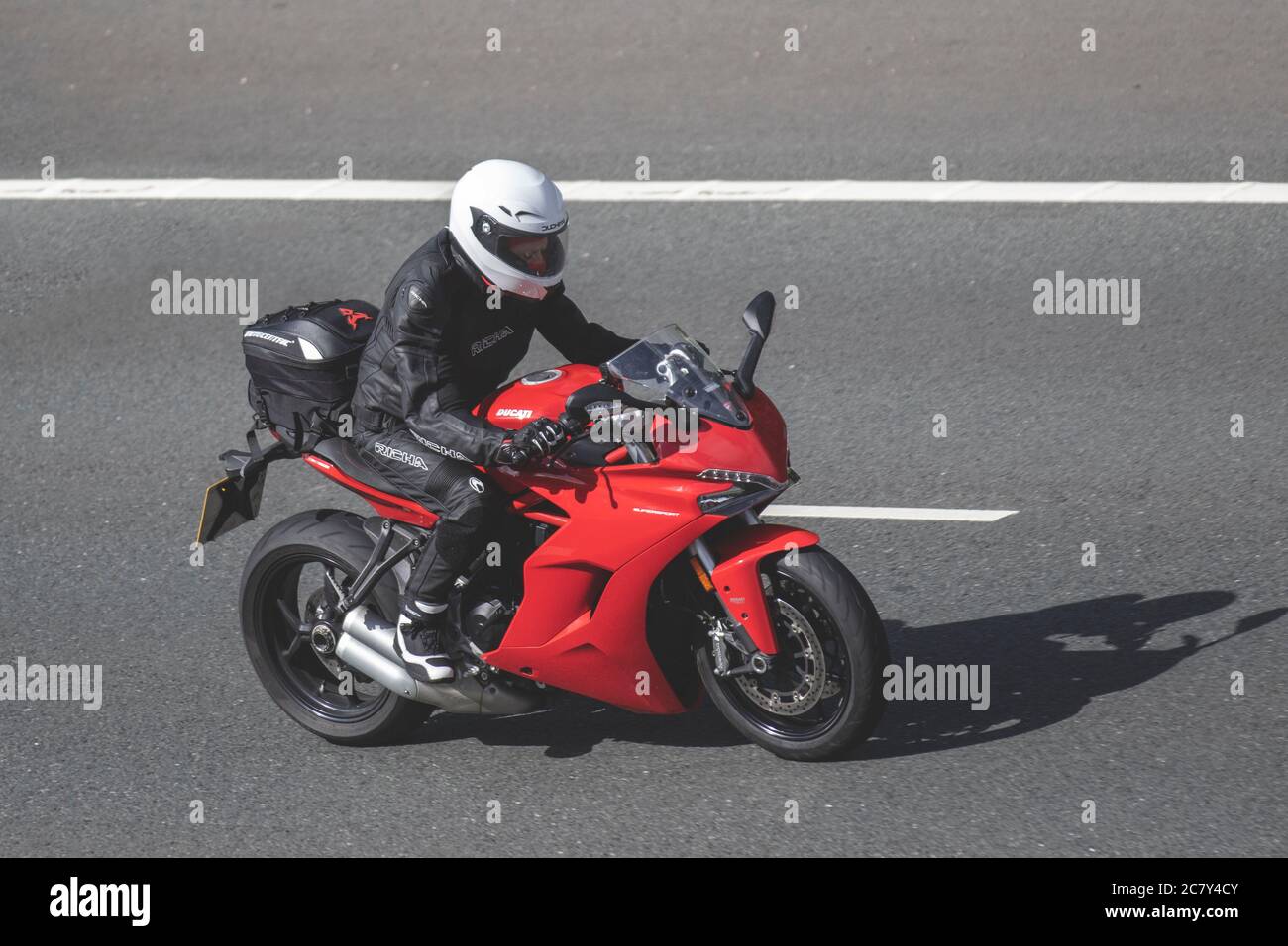 Ducati supersports motorcycle; Motorbike rider, two wheeled transport, motorcycles, vehicle, roads, motorbikes, bike riders motoring in Chorley, UK Stock Photo