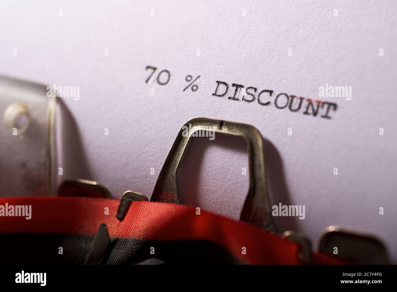 70 % discount text written on a paper. Stock Photo
