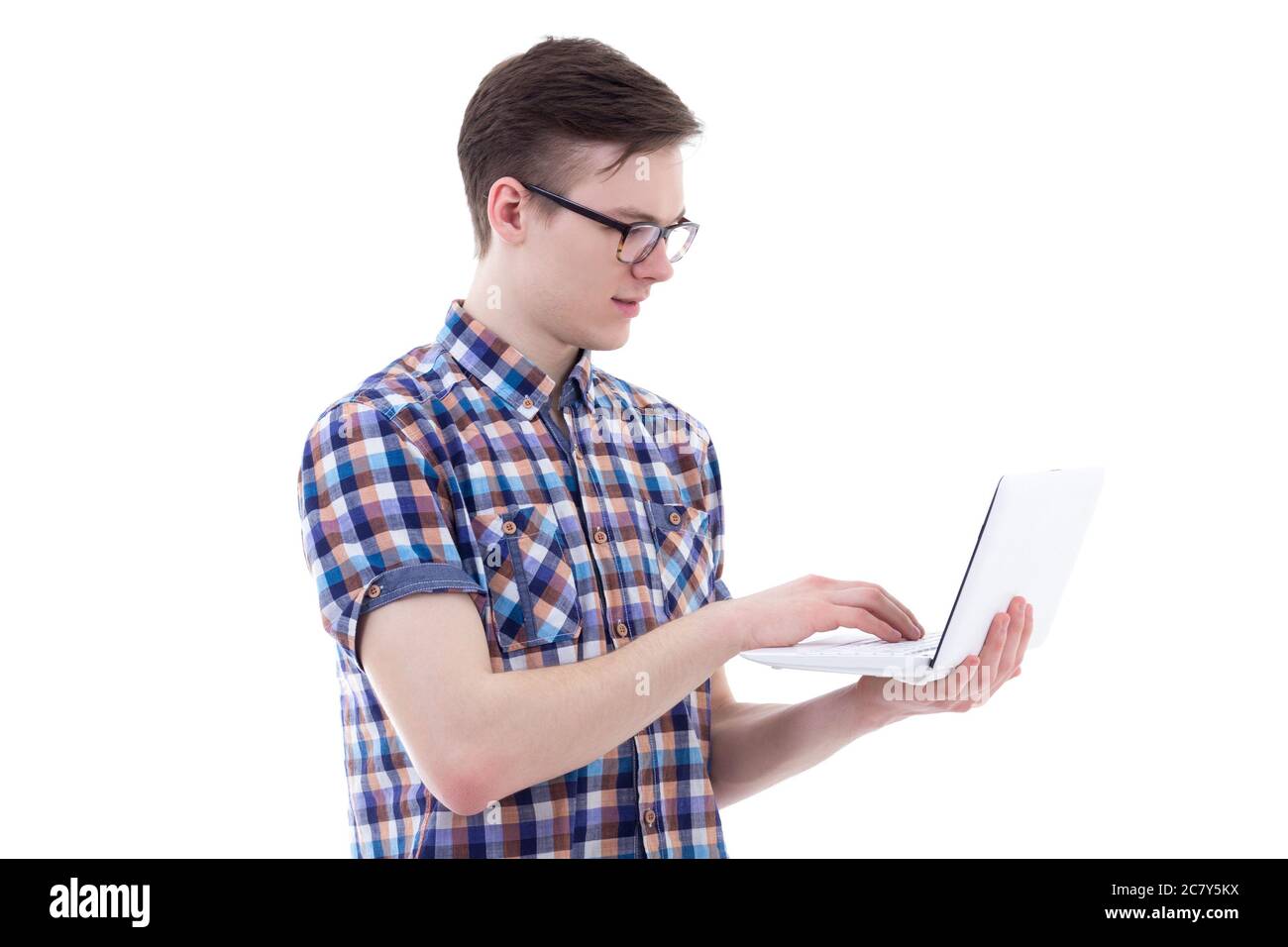 handsome teenage boy using laptop isolated on white background Stock ...