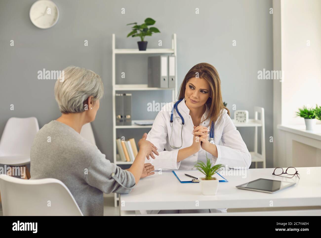 Woman talking with medical doctor hi-res stock photography and images ...