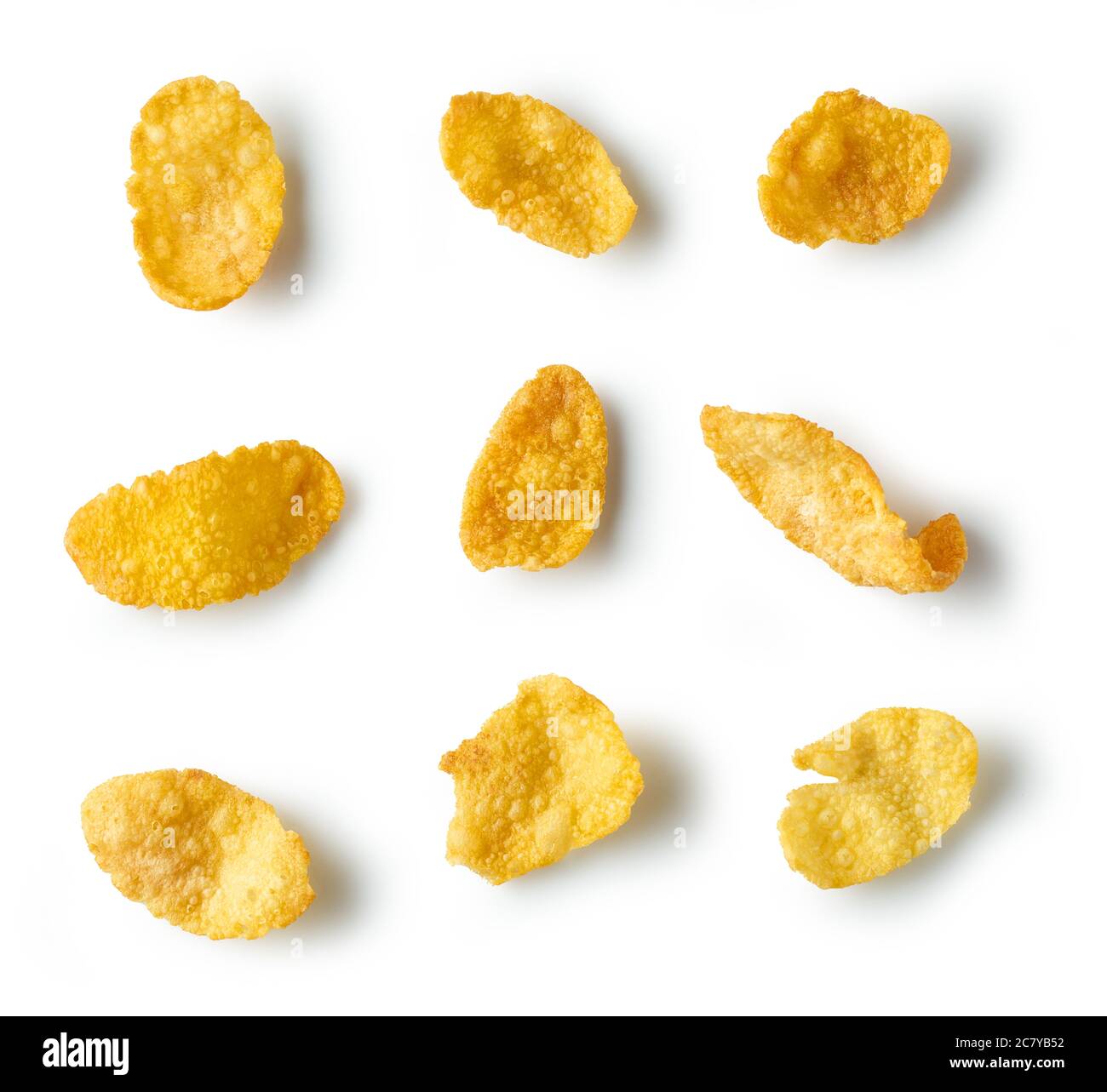 golden corn flakes macro isolated on white background, top view Stock Photo