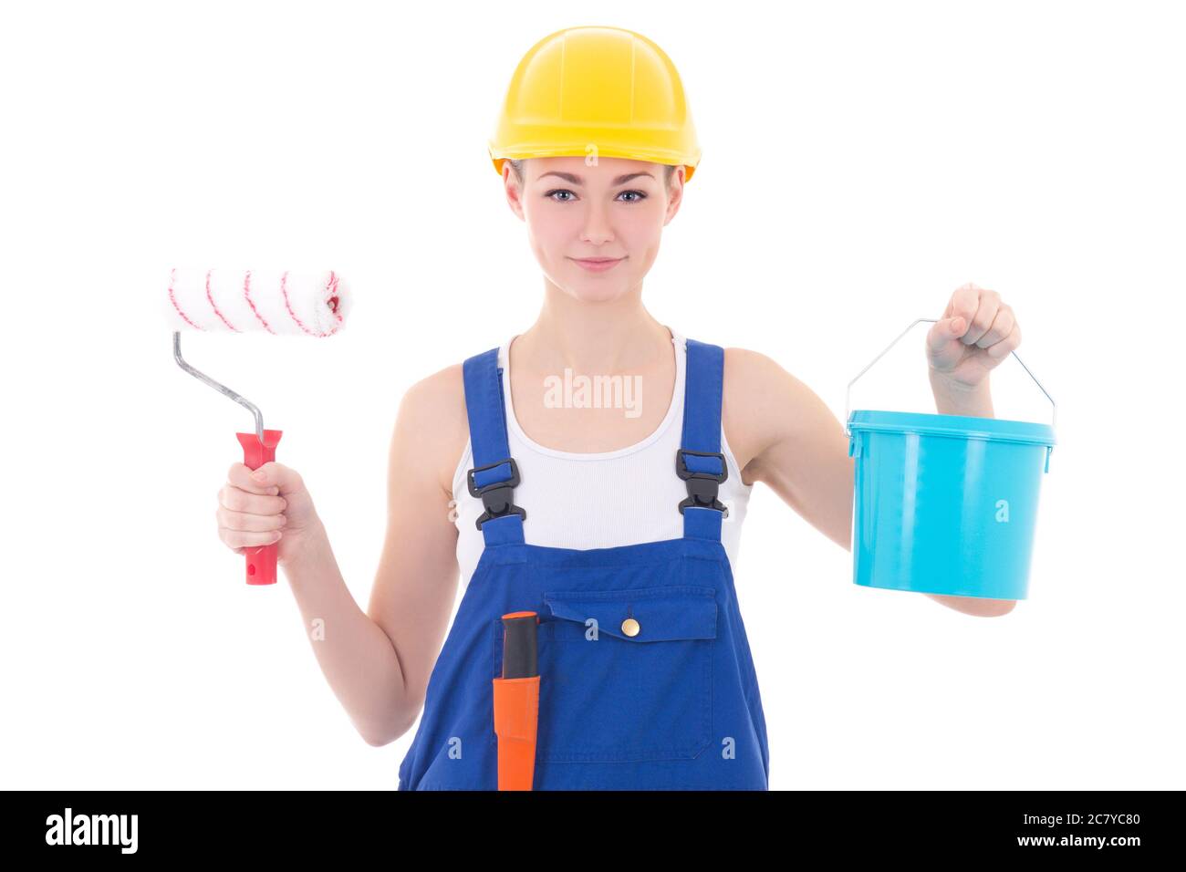 девушка красит стену. фотосессия маляр. женщина делает ремонт. маляр хозяйку. девушка с валиком.