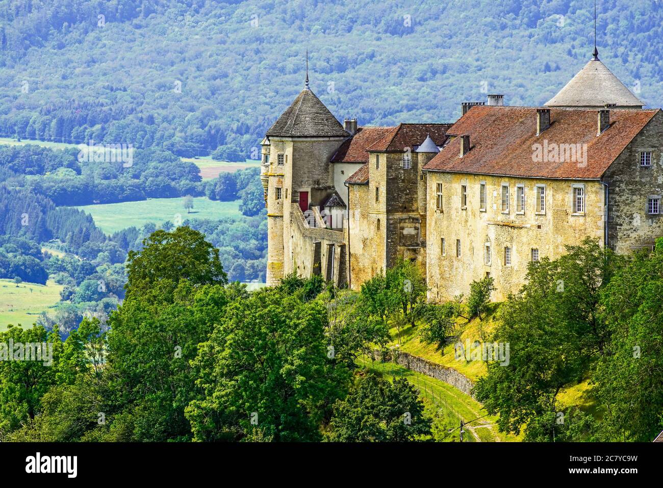 Medieval Chateau (castle) de Belvoir in Doubs department of the Bourgogne-Franche-Comte region in France. Overlooking  the valley of Sancey. Stock Photo