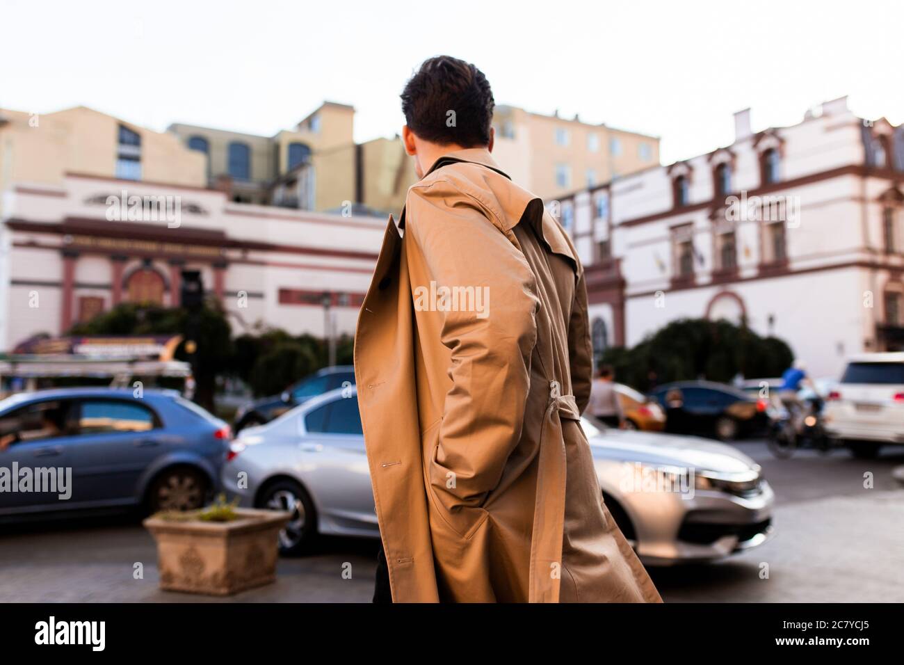 Man in trench coat walking hi-res stock photography and images - Alamy